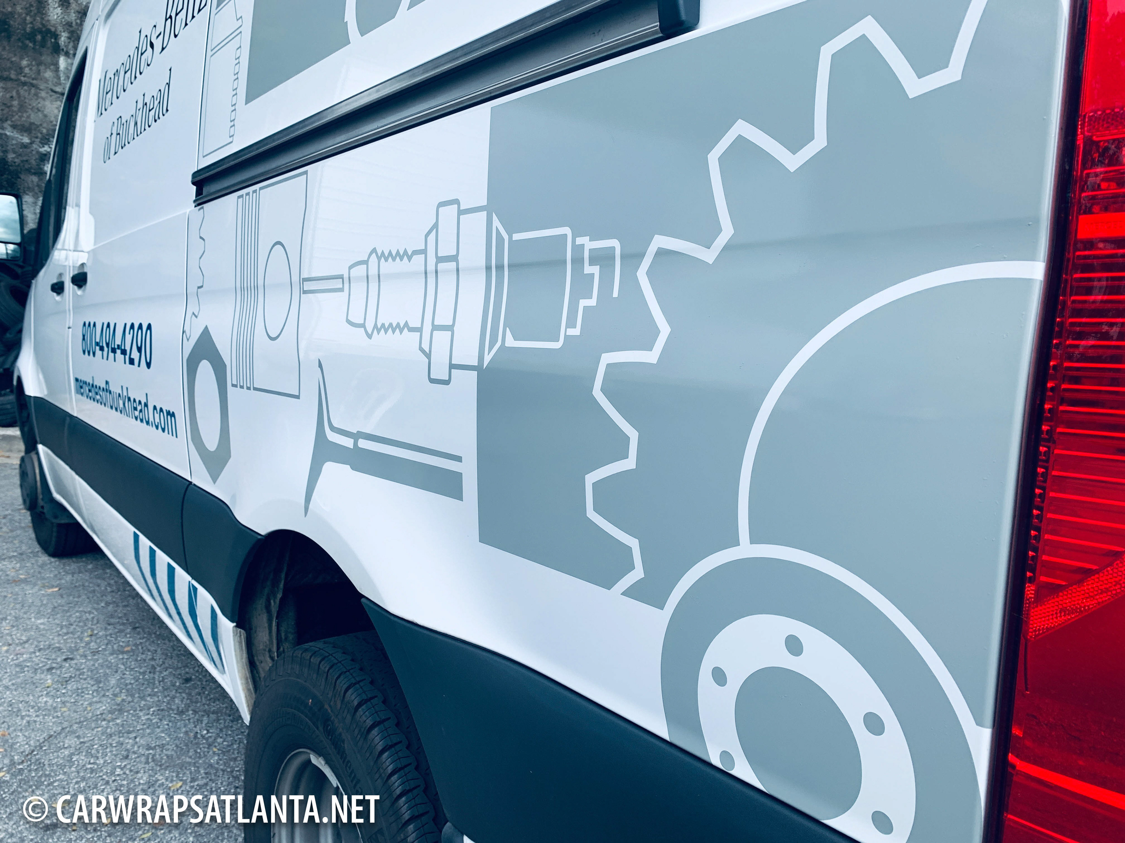 Full view of the wrapped Mercedes-Benz Sprinter van highlighting the finished partial wrap graphics.