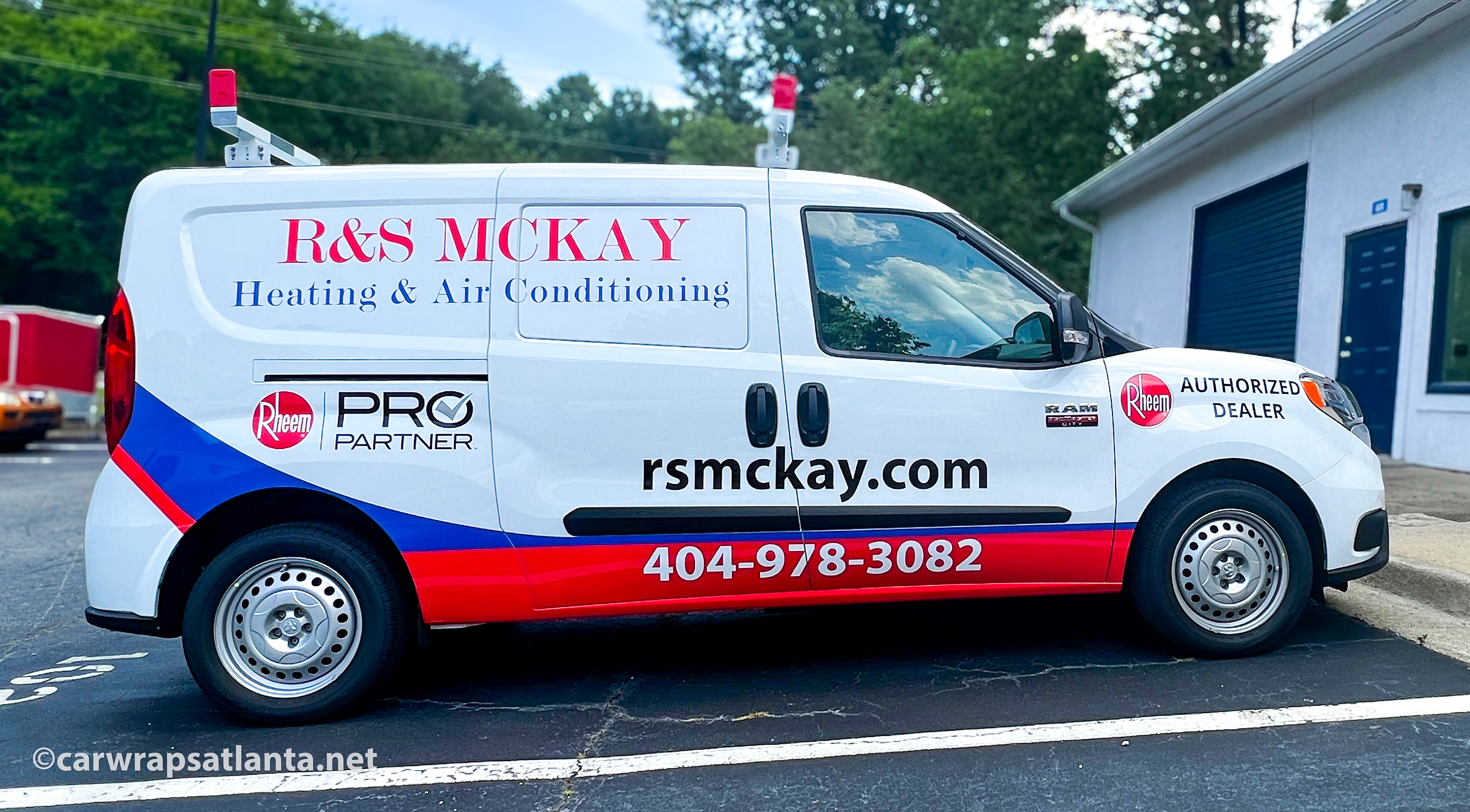 Close-up of the HVAC company's logo and detailed spot graphics on the Ram ProMaster van.