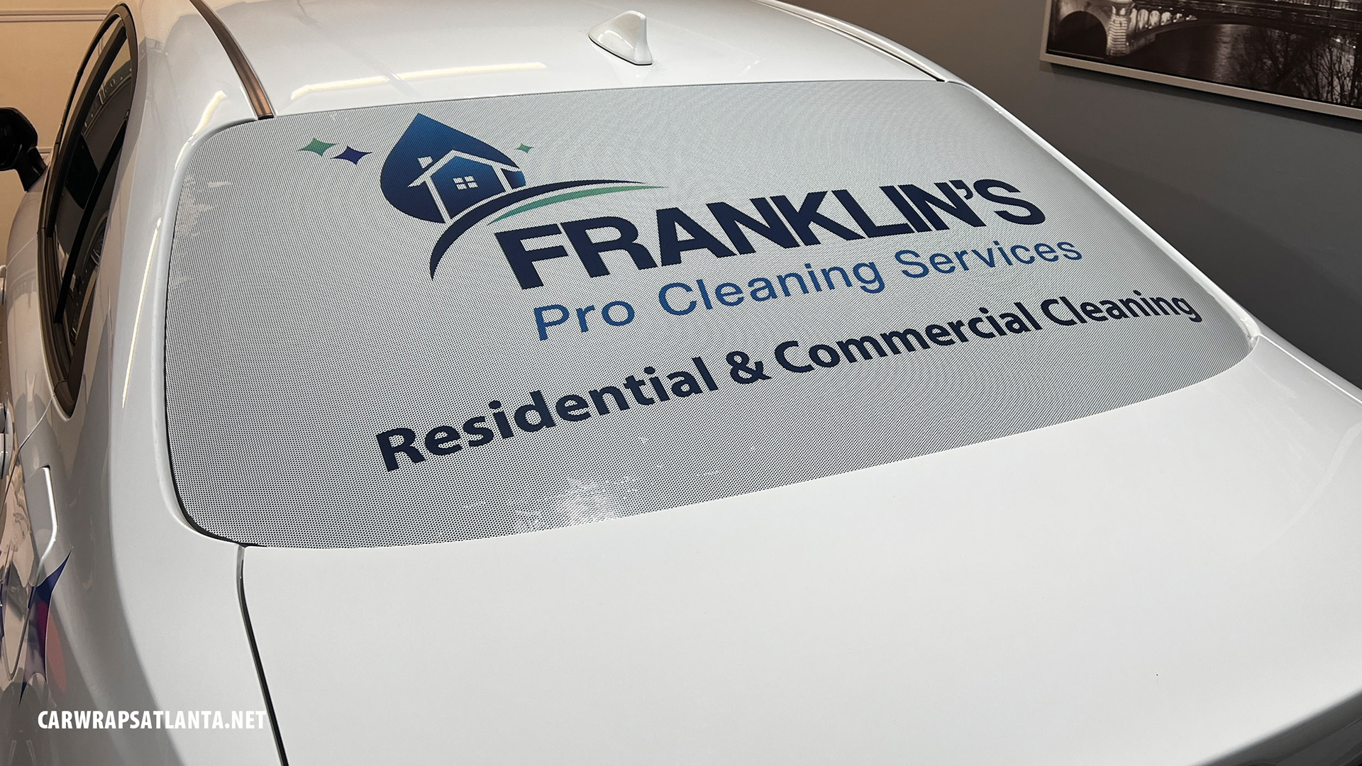 A back window graphics, perforated vinyl for Franklin's Cleaning in Atlanta.