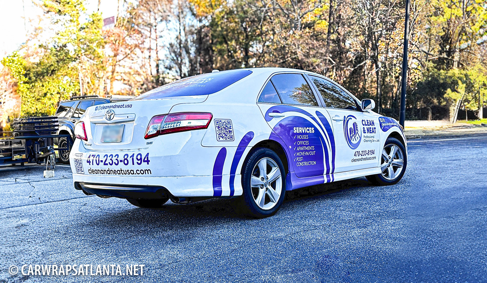 Side view of the partial vehicle wrap on the Toyota Camry showcasing cohesive branding.