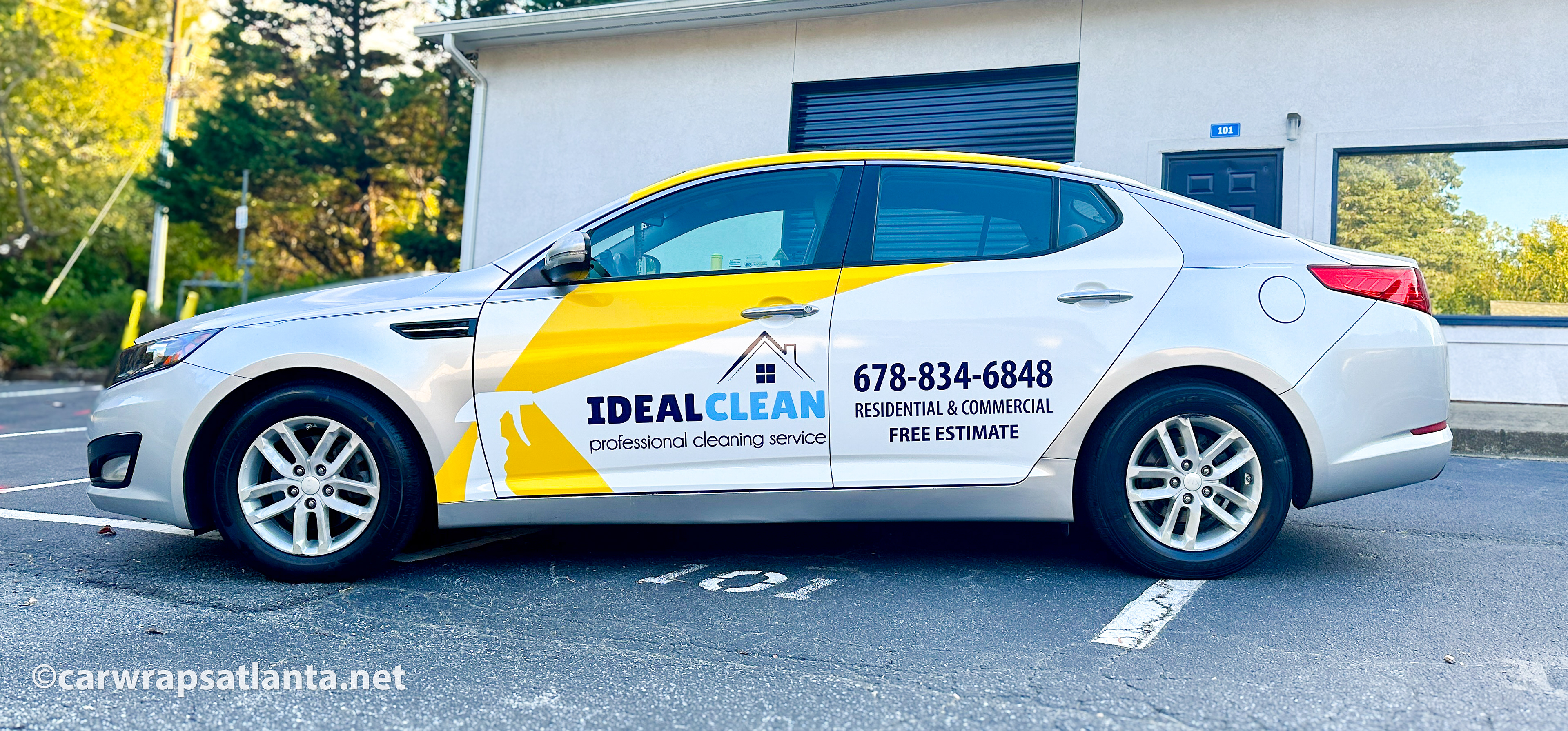 Hero image: Custom spot graphics on a Kia Optima sedan for a cleaning service company in Kennesaw, GA.