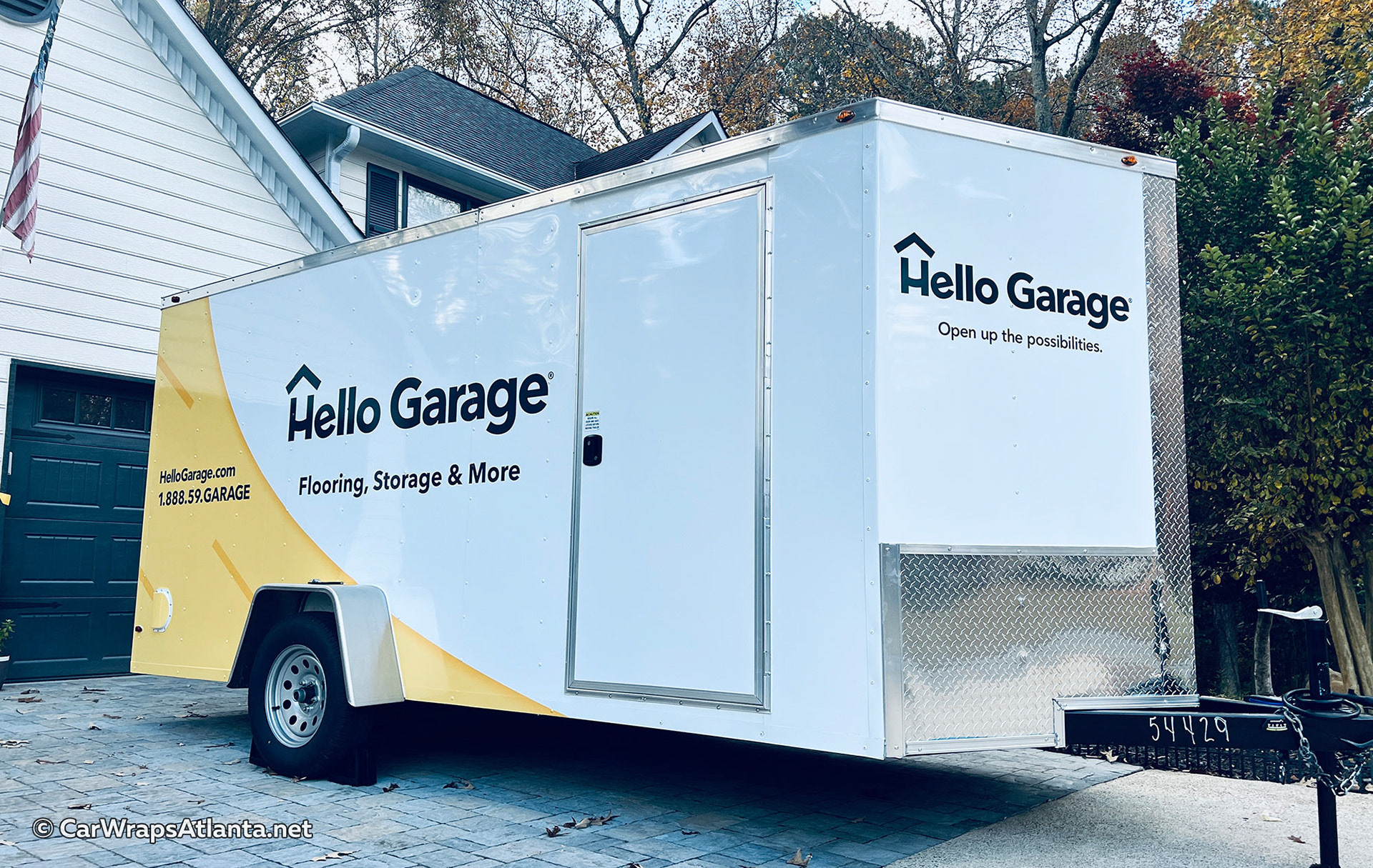 Close-up of the garage renovation service graphics and contact information on the trailer wrap.