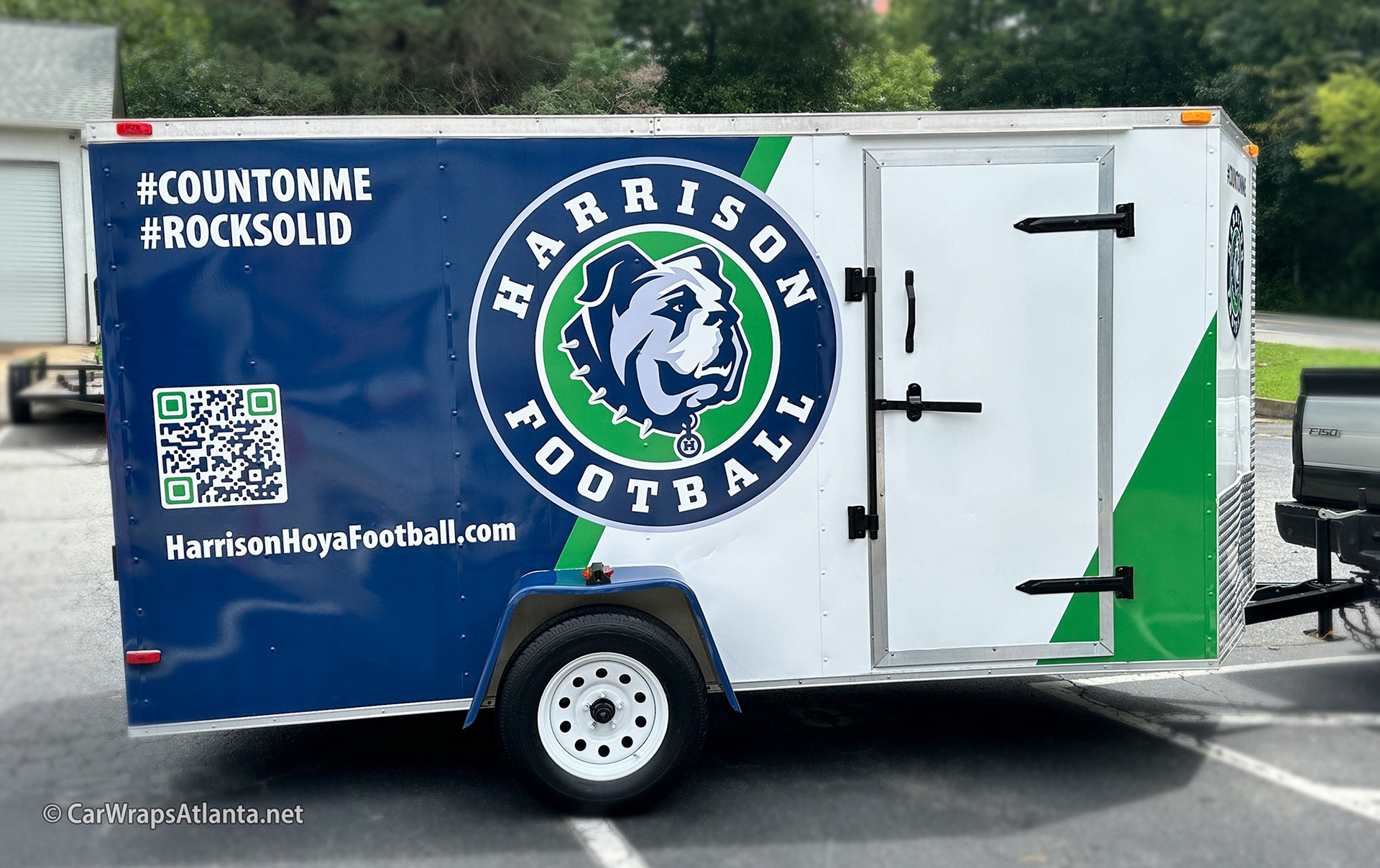 Hero image: Full trailer wrap featuring custom graphics for Harrison Hoya Football in Kennesaw, GA.