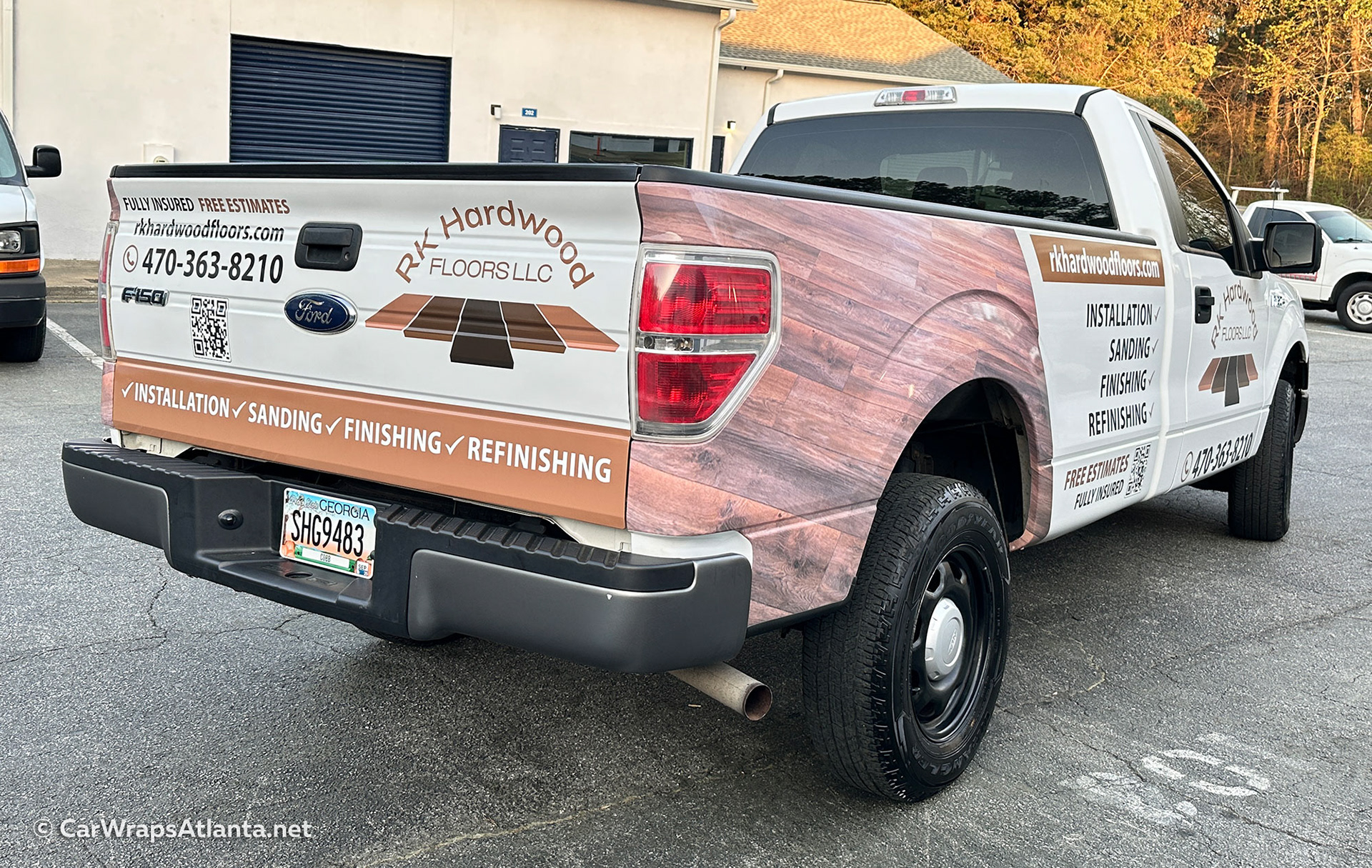 Branded fleet wrap design on white Ford F-150 showcasing flooring services in Atlanta