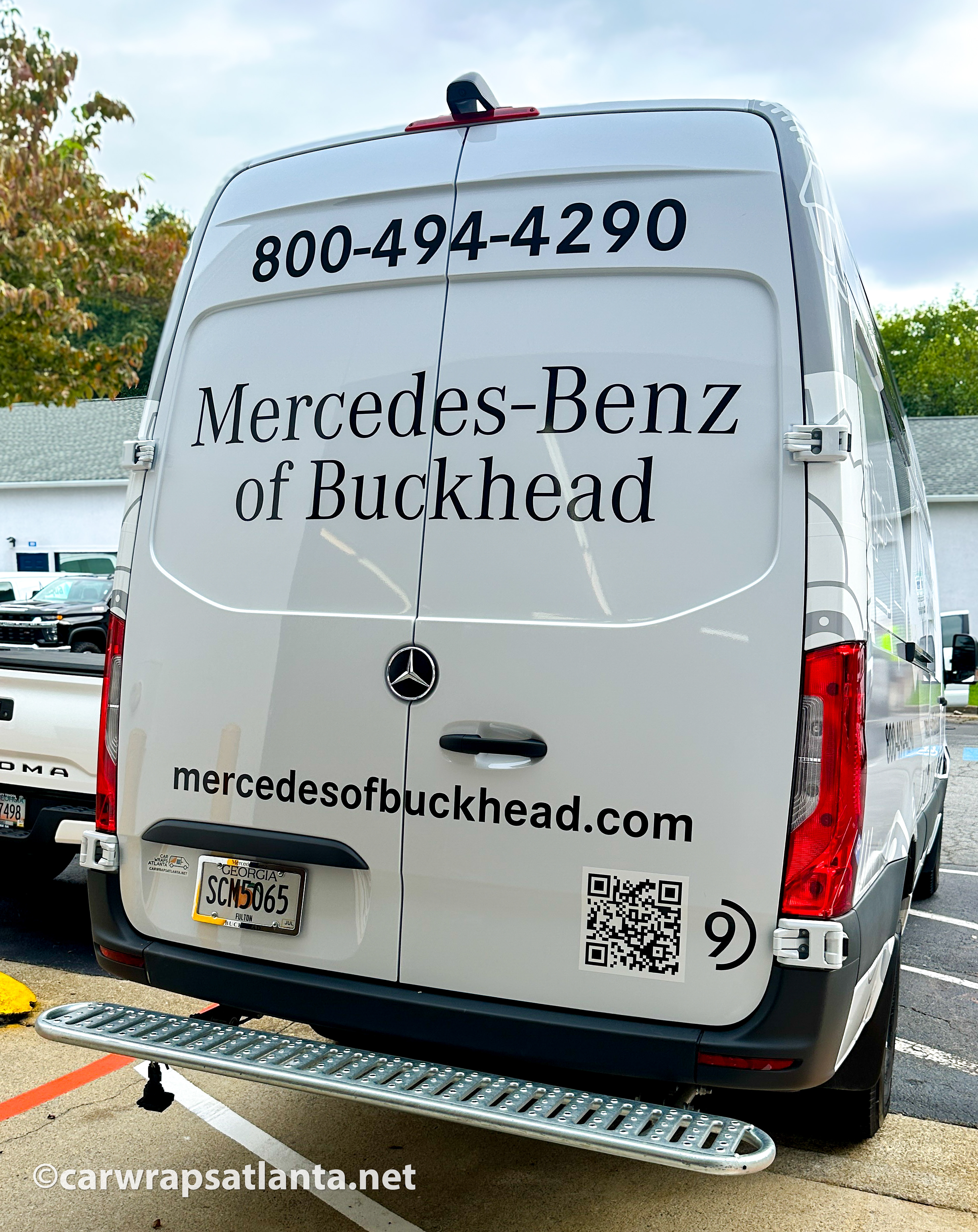 Close-up of the Mercedes-Benz of Buckhead logo and contact details on the Sprinter van spot graphics.