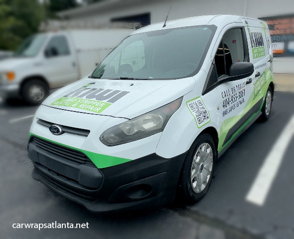 Close-up of logo and high-contrast graphics on the Ford Transit Connect partial wrap.