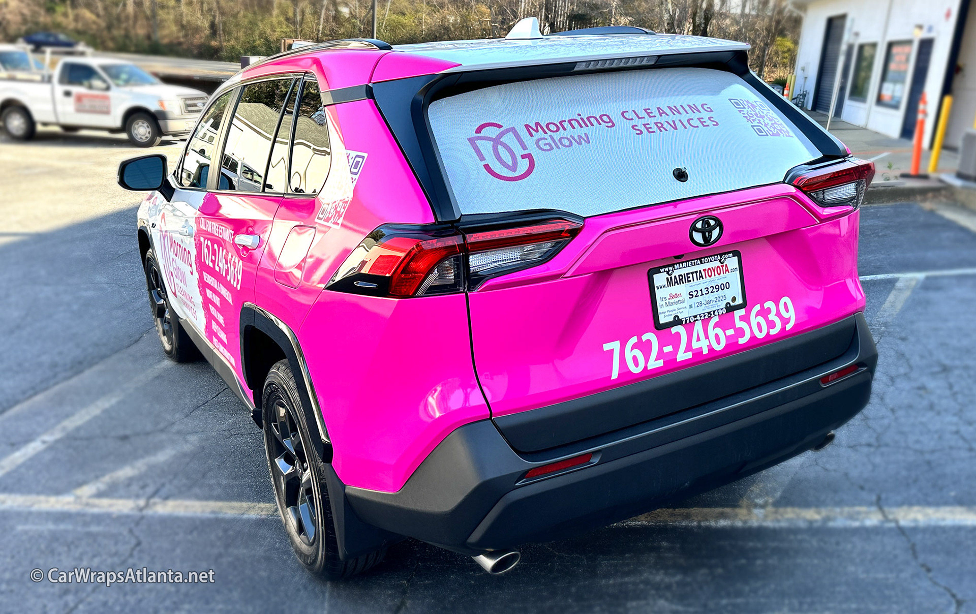 Rear view of the Toyota RAV4 partial wrap showcasing high-visibility contact information.