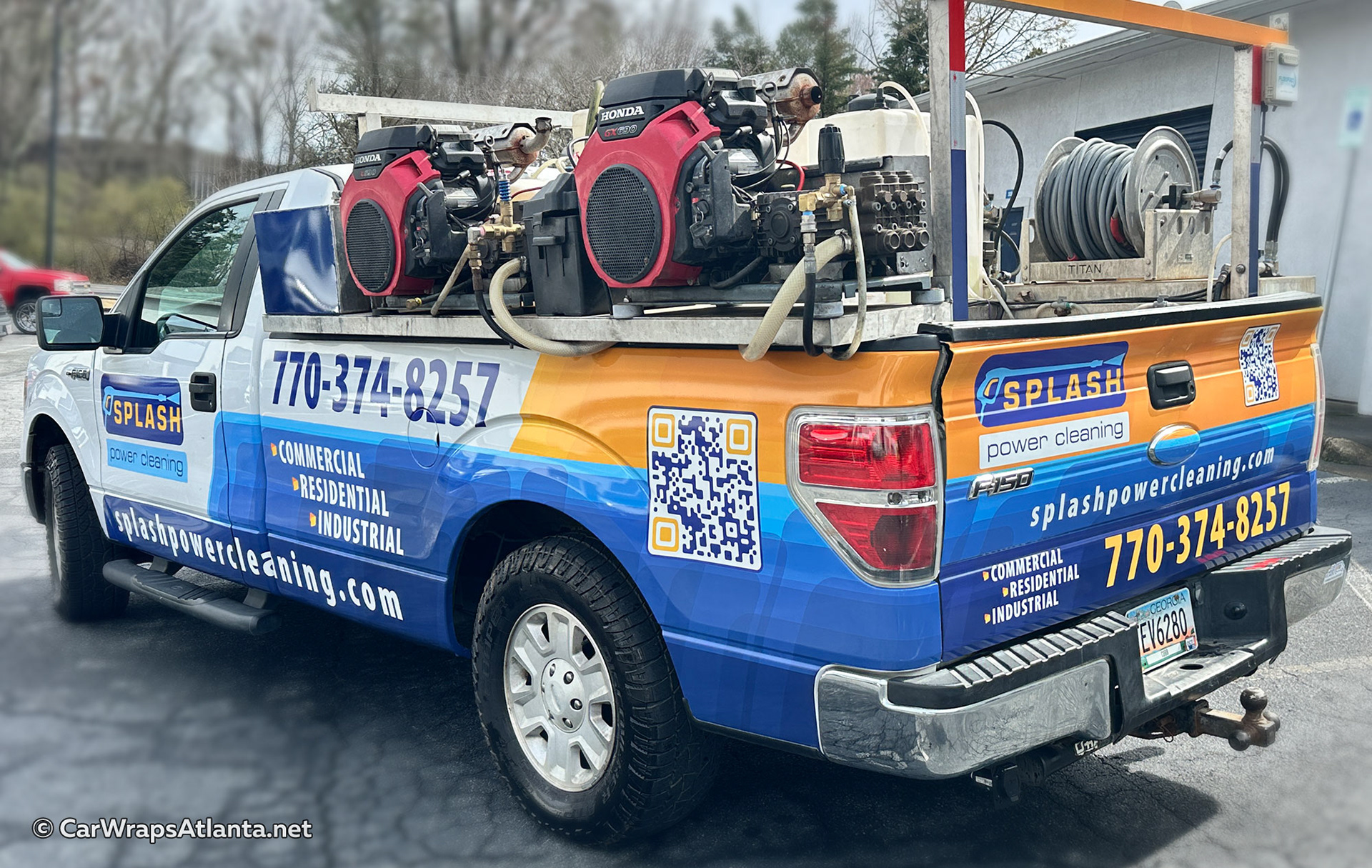 Commercial F-150 with vinyl fleet graphics showcasing pressure washing services and contact details