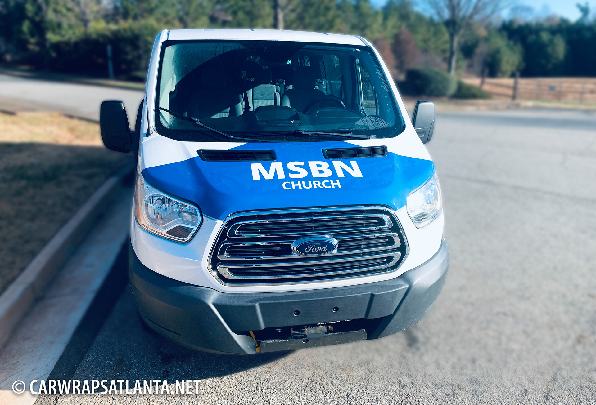 Side view of the partial Ford Transit wrap, demonstrating strategic graphic placement.