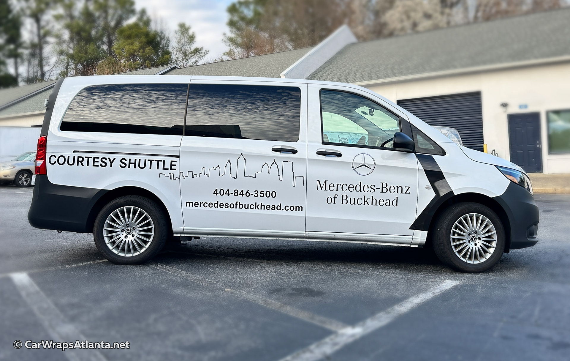 Spot graphics on Mercedes-Benz Metris shuttle van for Mercedes-Benz of Buckhead featuring custom vinyl vehicle graphics and dealership branding.