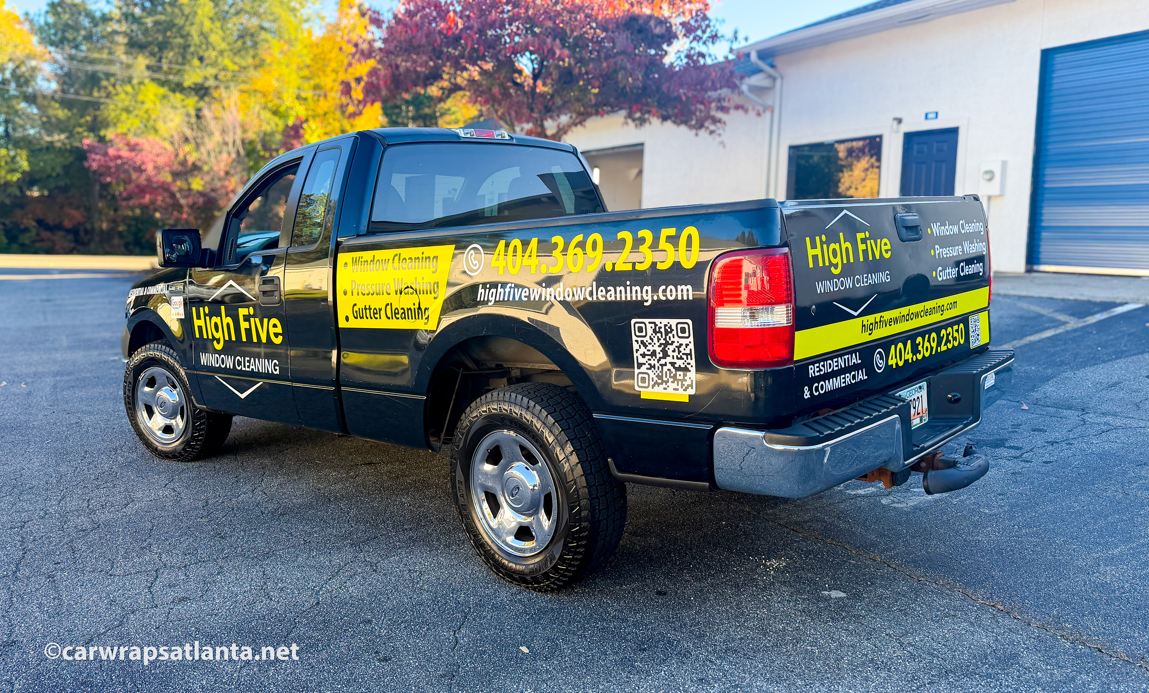 Full side view of the Ford F150 with spot graphics demonstrating effective window cleaning service advertisement.