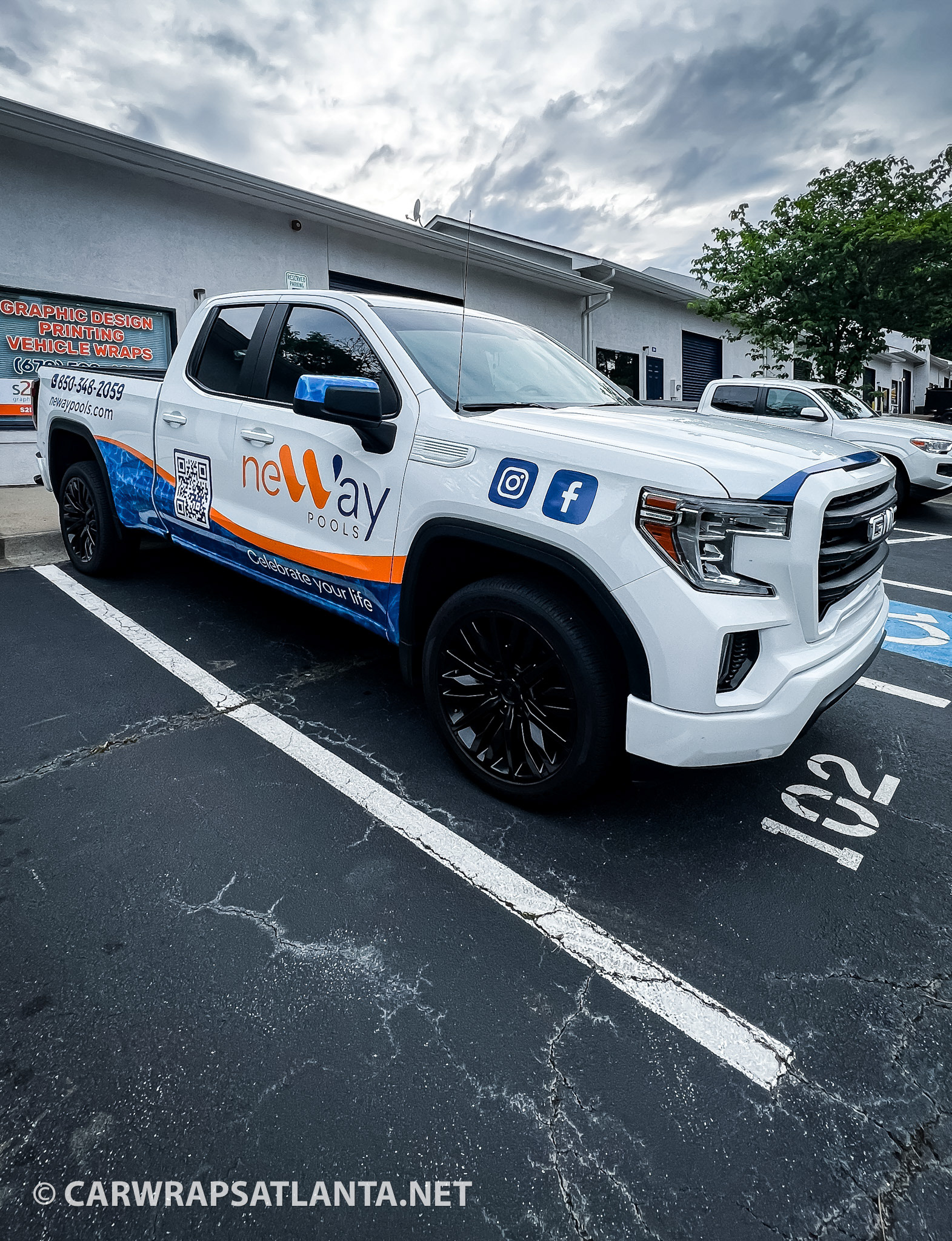 Close-up of the partial wrap placement on the rear panel of the GMC truck in Tallahassee.
