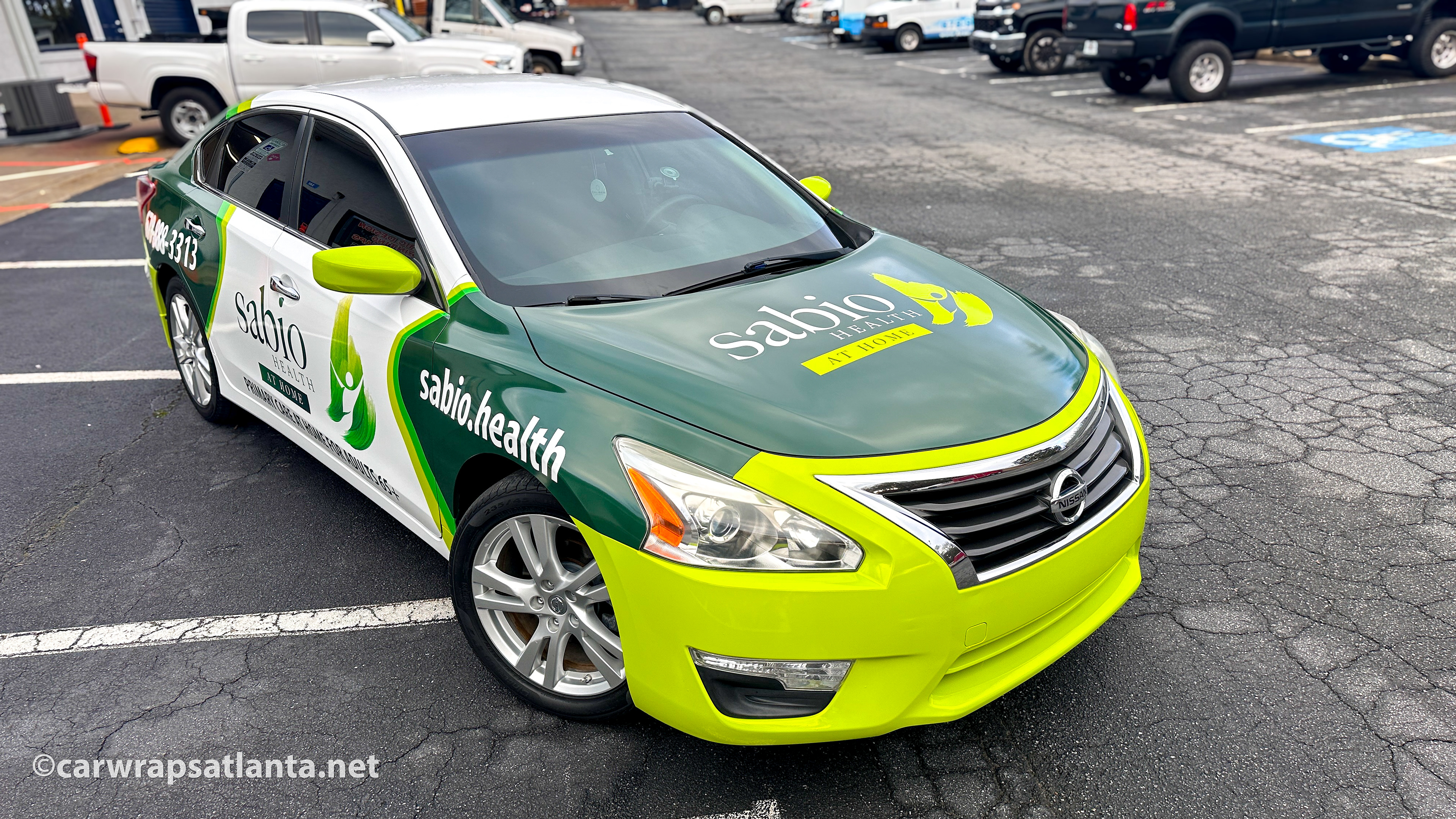 Close-up of the medical services branding and contact details on a completed healthcare vehicle full wrap.