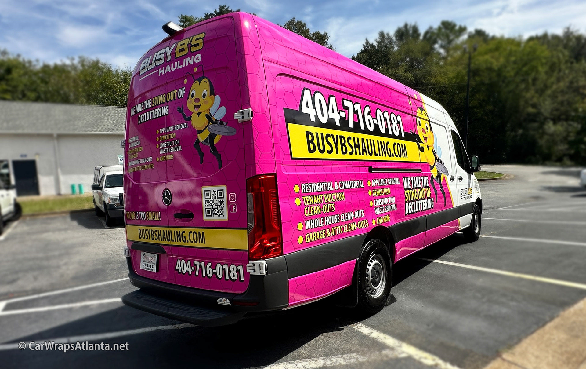 Side view of the wrapped Sprinter van promoting Busy B's Hauling's services across Atlanta.