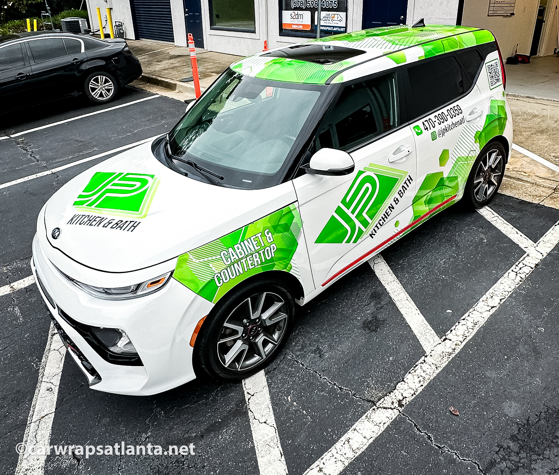 lose-up of the kitchen and countertop services branding on the Kia Soul partial wrap.