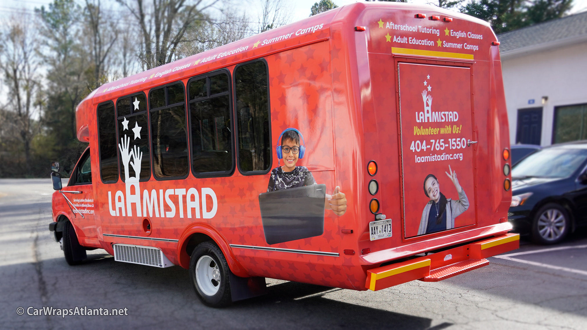 Full view of the custom wrapped bus showcasing the high-impact design for the non-profit fleet.