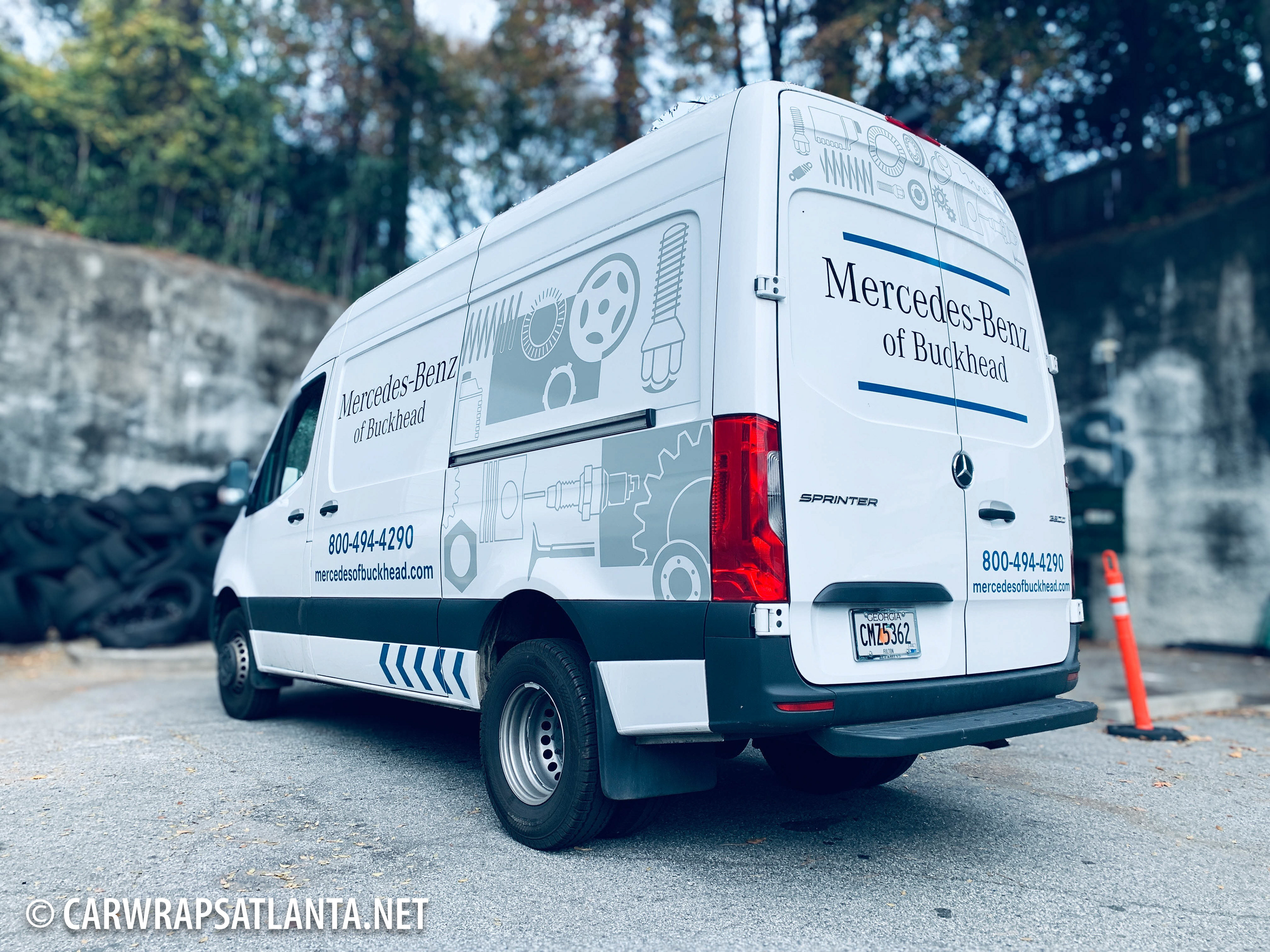 Professional installation process on the Mercedes-Benz Sprinter van partial wrap.