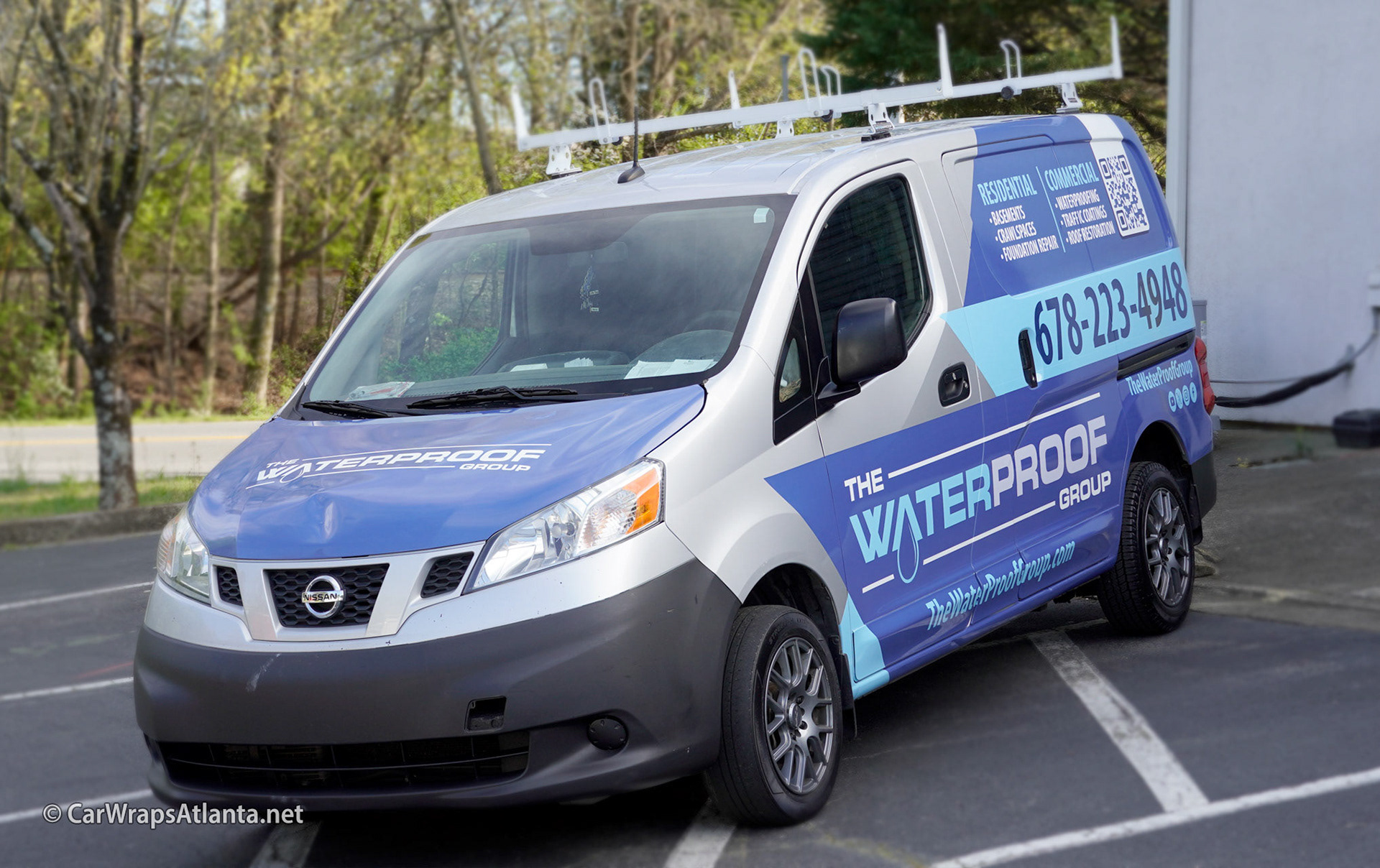 Close-up of the strategic partial wrap placement on the side panel of the Nissan NV200 van.