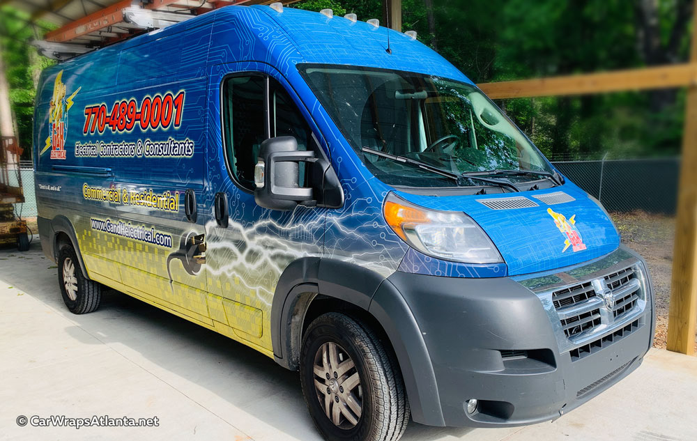 Close-up view of high-quality fleet graphics and logo on the Dodge van wrap vinyl.