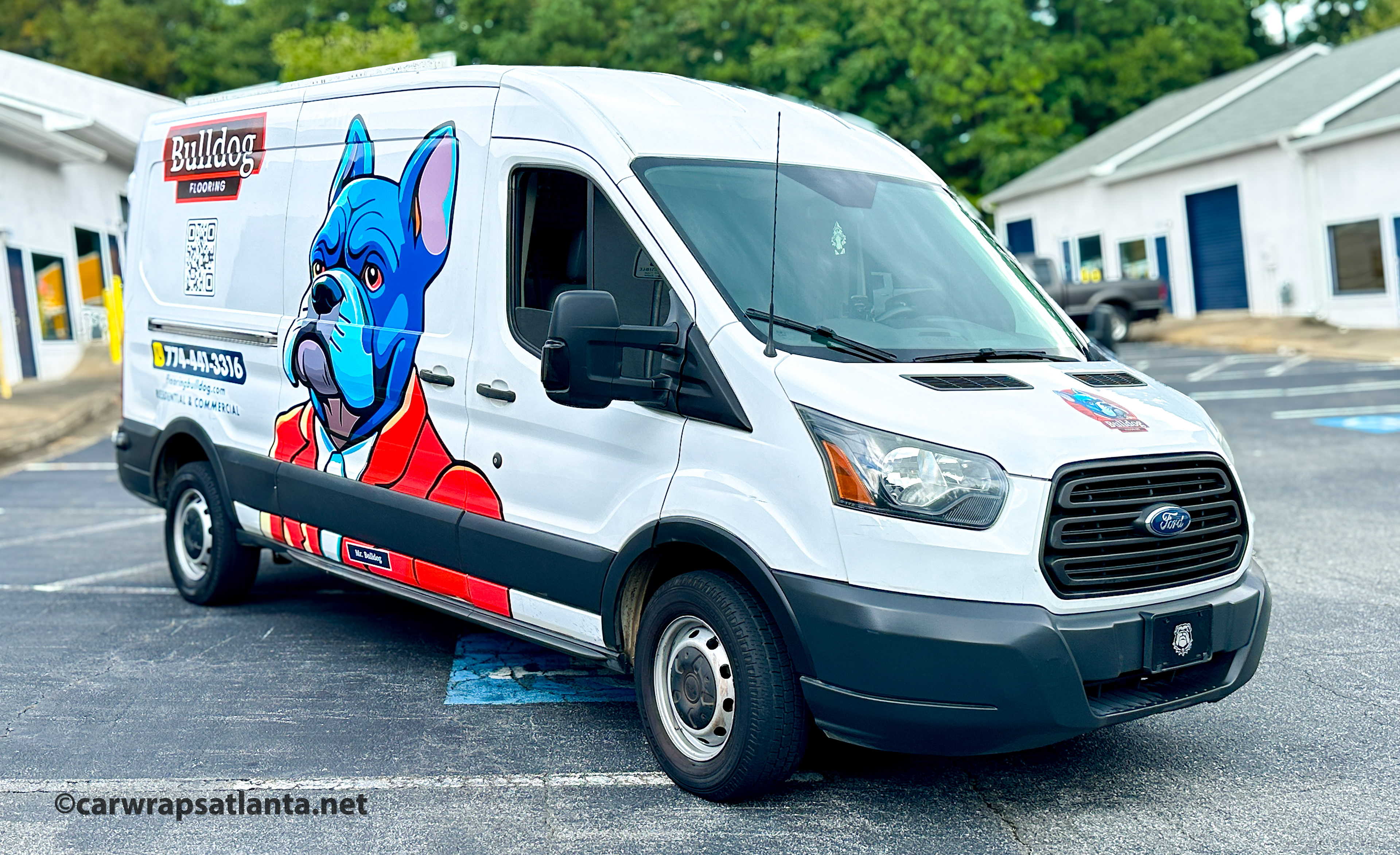Side view of the Ford Transit partial wrap demonstrating effective mobile advertising for the flooring company.