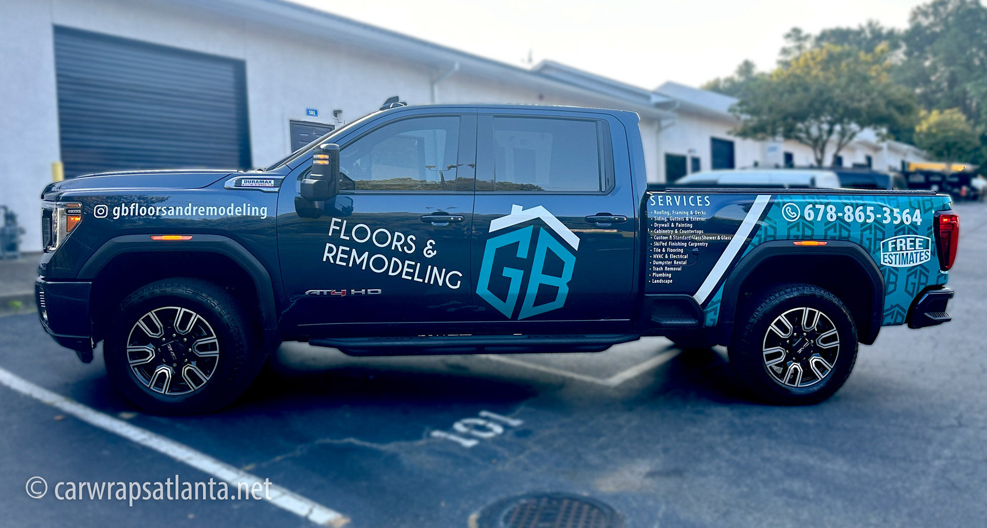 Close-up of the partial wrap on the GMC Sierra door, showcasing high-quality vinyl graphics.