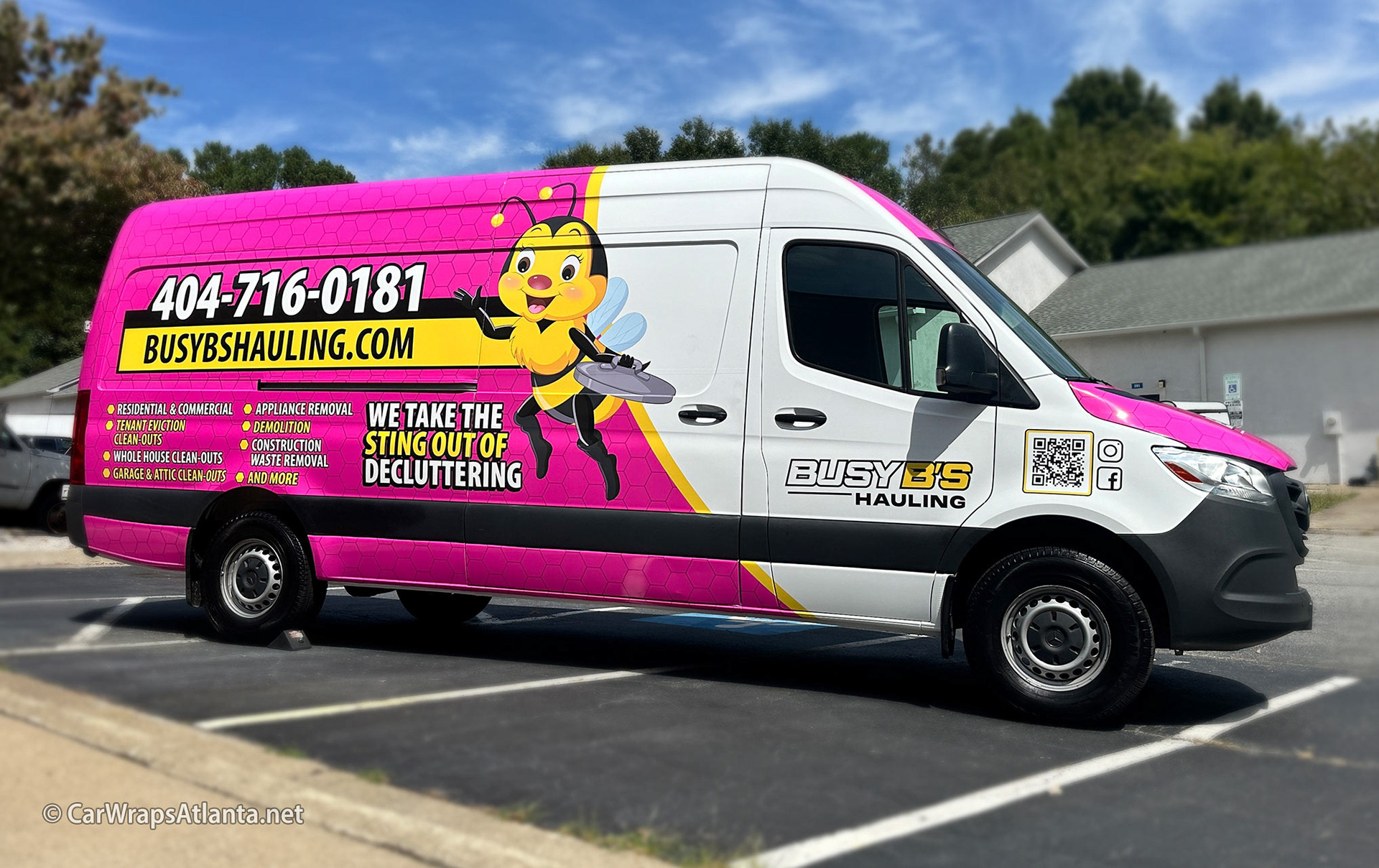 Vibrant full vehicle wrap on a Mercedes-Benz Sprinter van for Busy B's Hauling in Atlanta.