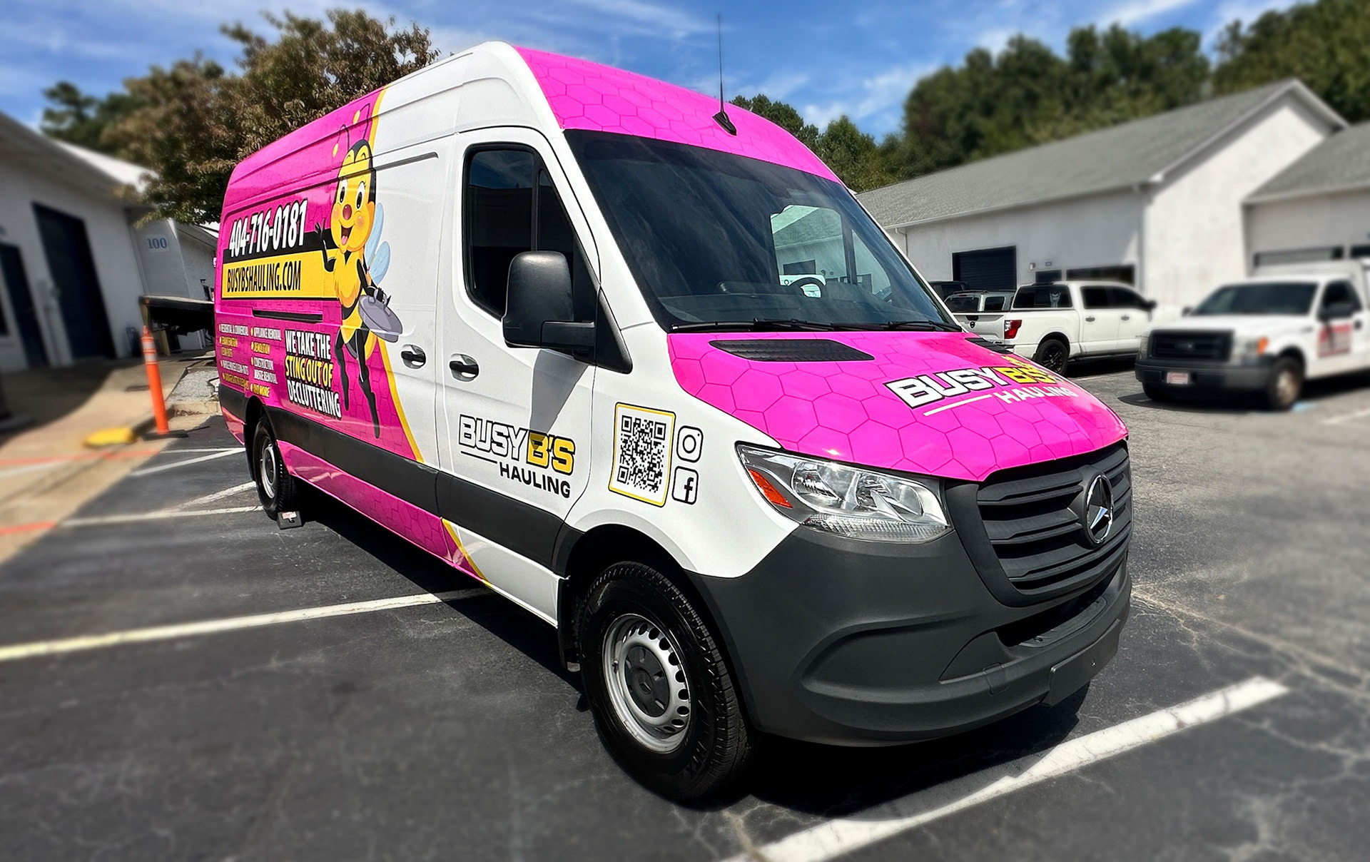 Professional full vehicle wrap installation process on the Mercedes-Benz Sprinter van in Atlanta.