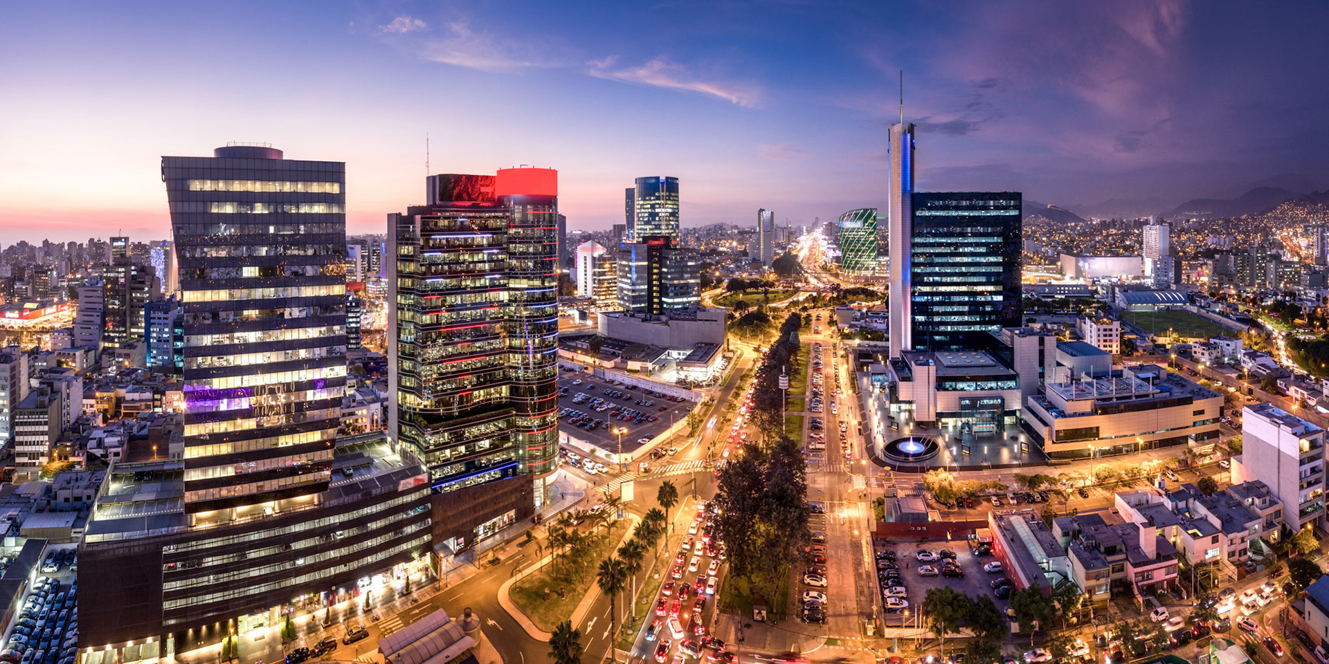 LIMA, PERU: Panoramic view of skyline in San Isidro district at blue time.