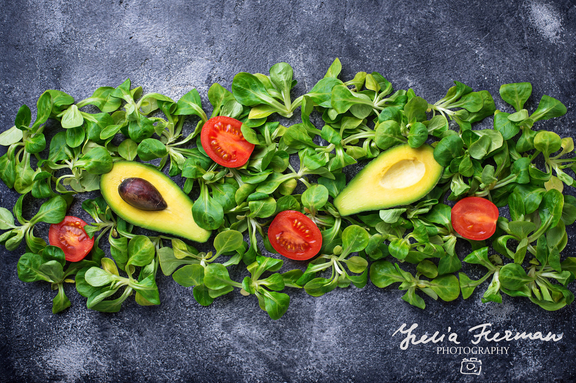 Green food background with corn lettuce, tomato and avocado. Top view