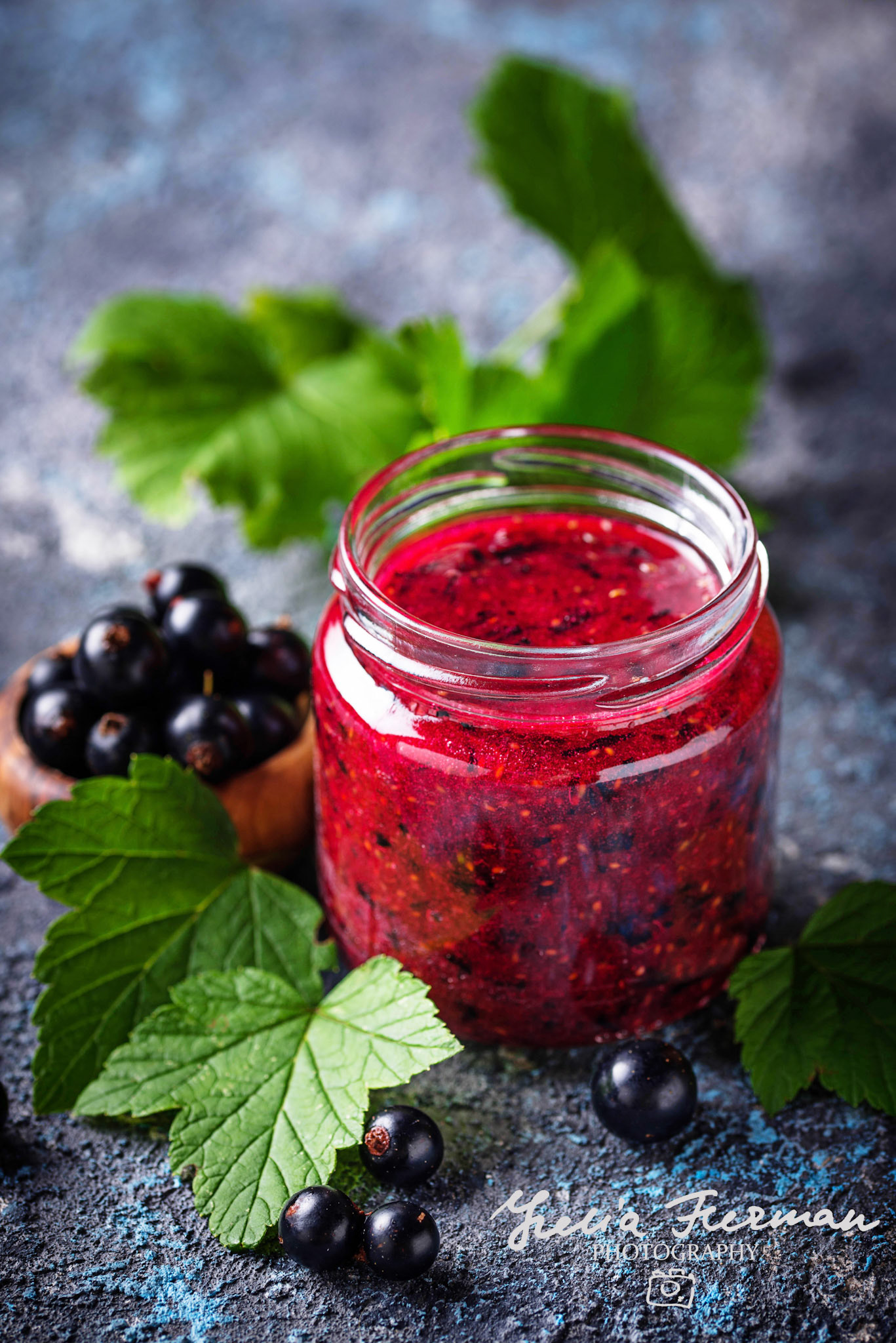 Black currant jam in jar. Selective focus
