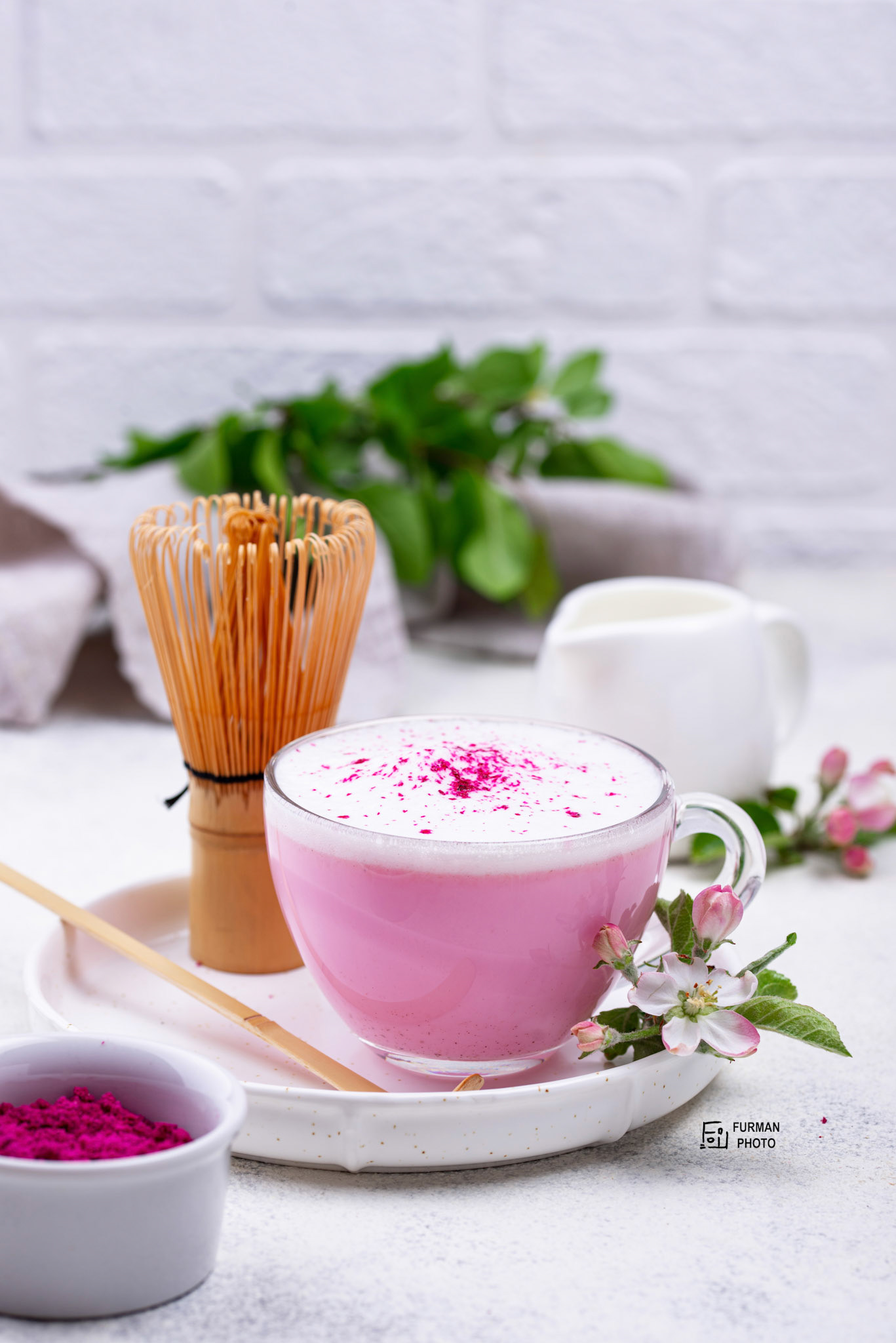 Pink matcha latte with milk. Trendy drink from dragon fruit powder