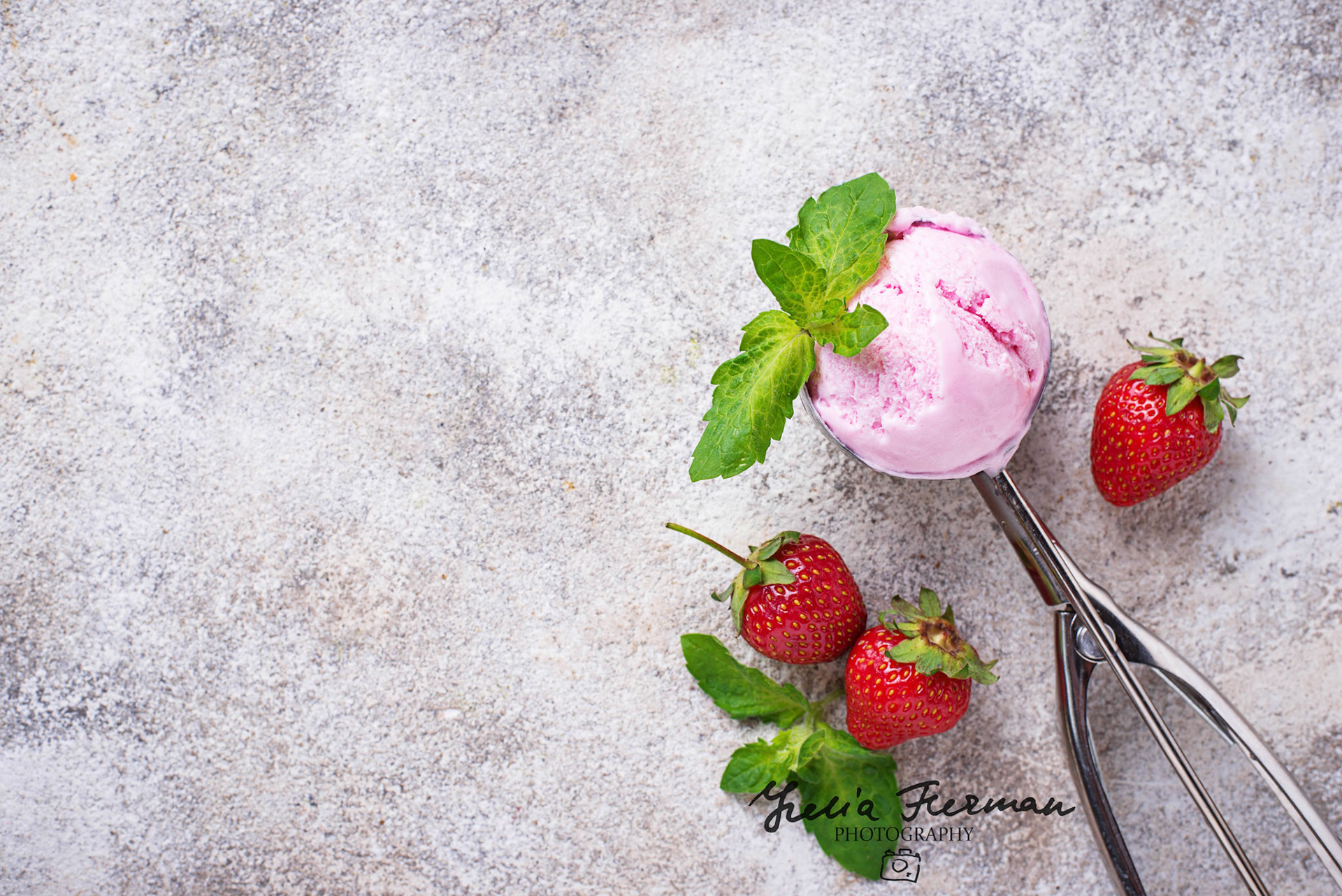 Ball of strawberry Ice cream in scoop. Top view