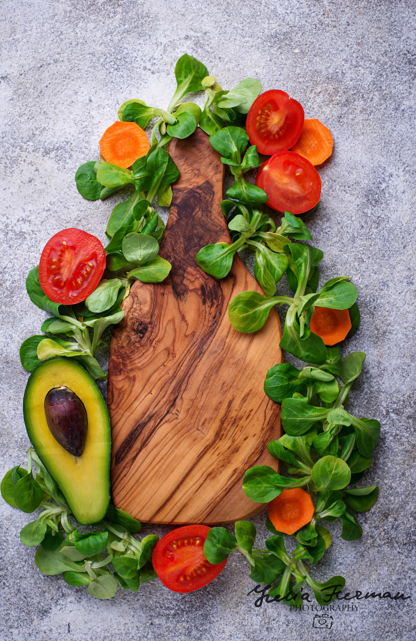 Green food background with corn lettuce, tomato and avocado. Top view