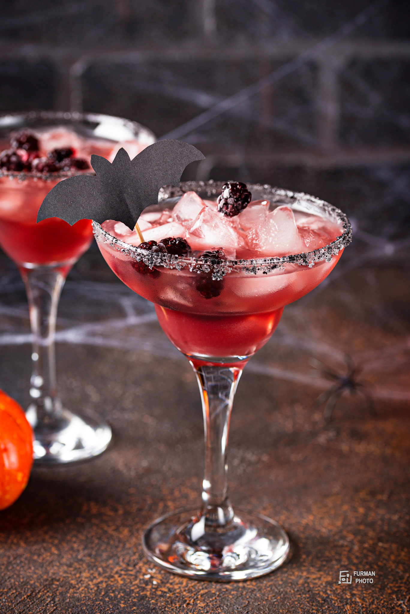 Halloweens spooky drink. Cocktail with blackberry
