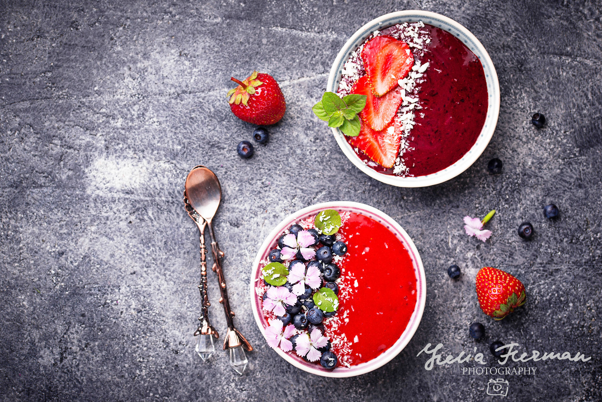 Smoothie bowls with strawberry and blueberry. Top view