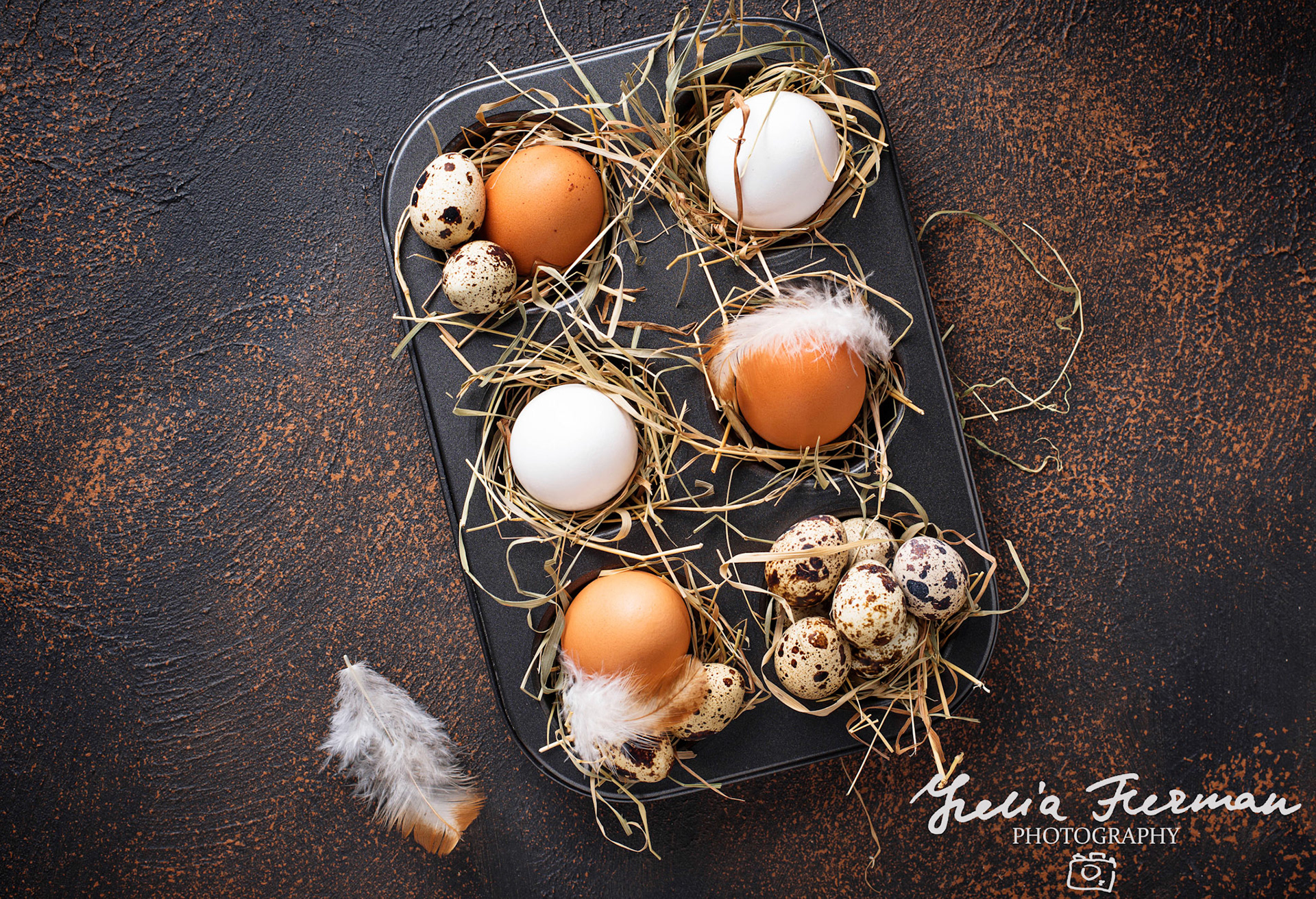 Fresh raw chicken and quail eggs in sieve. Top view