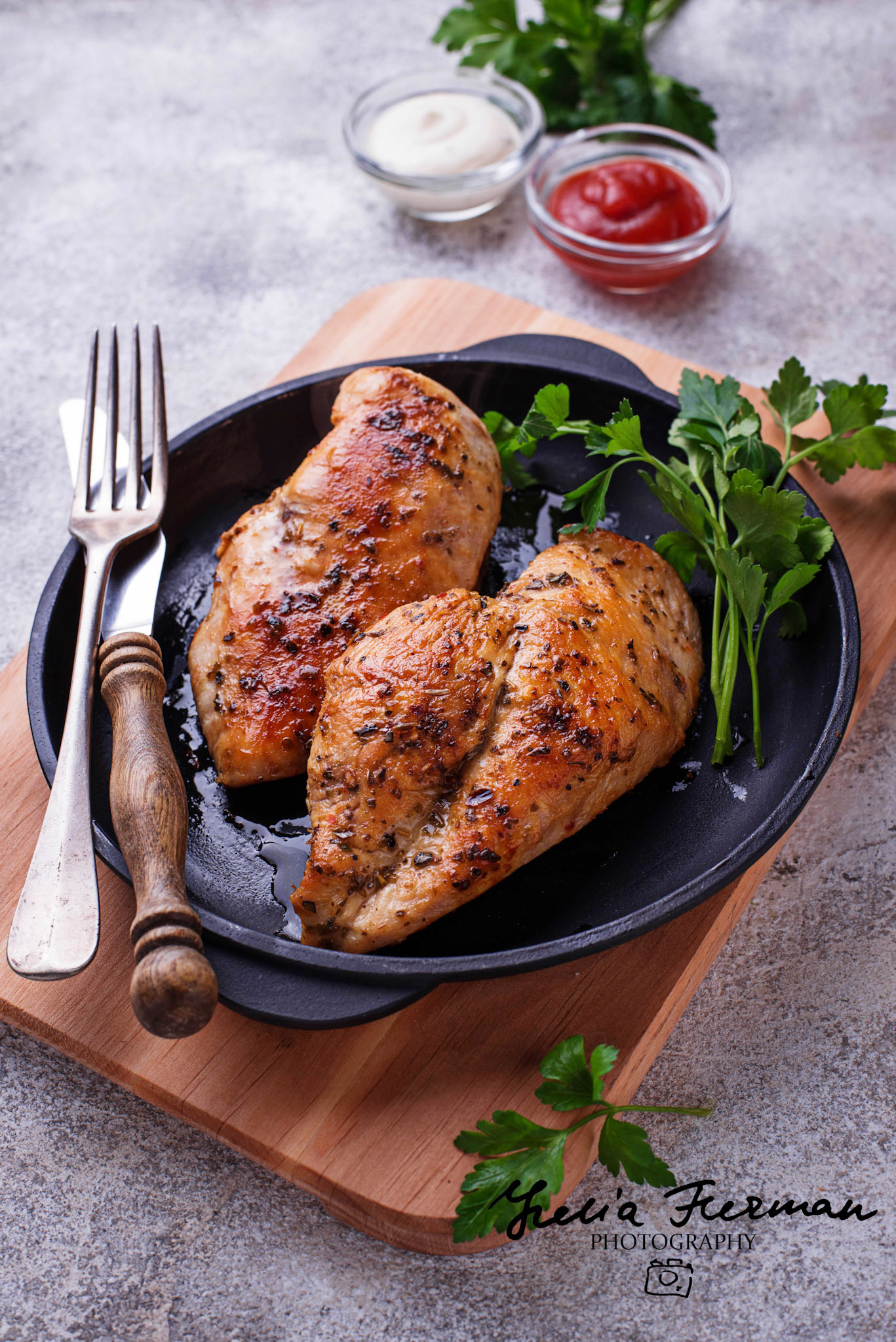 Grilled chicken breast or fillet on iron pan. Top view