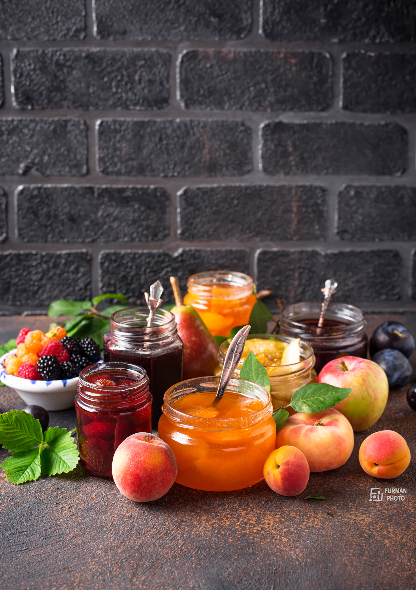 Assortment of different homemade jams in gars