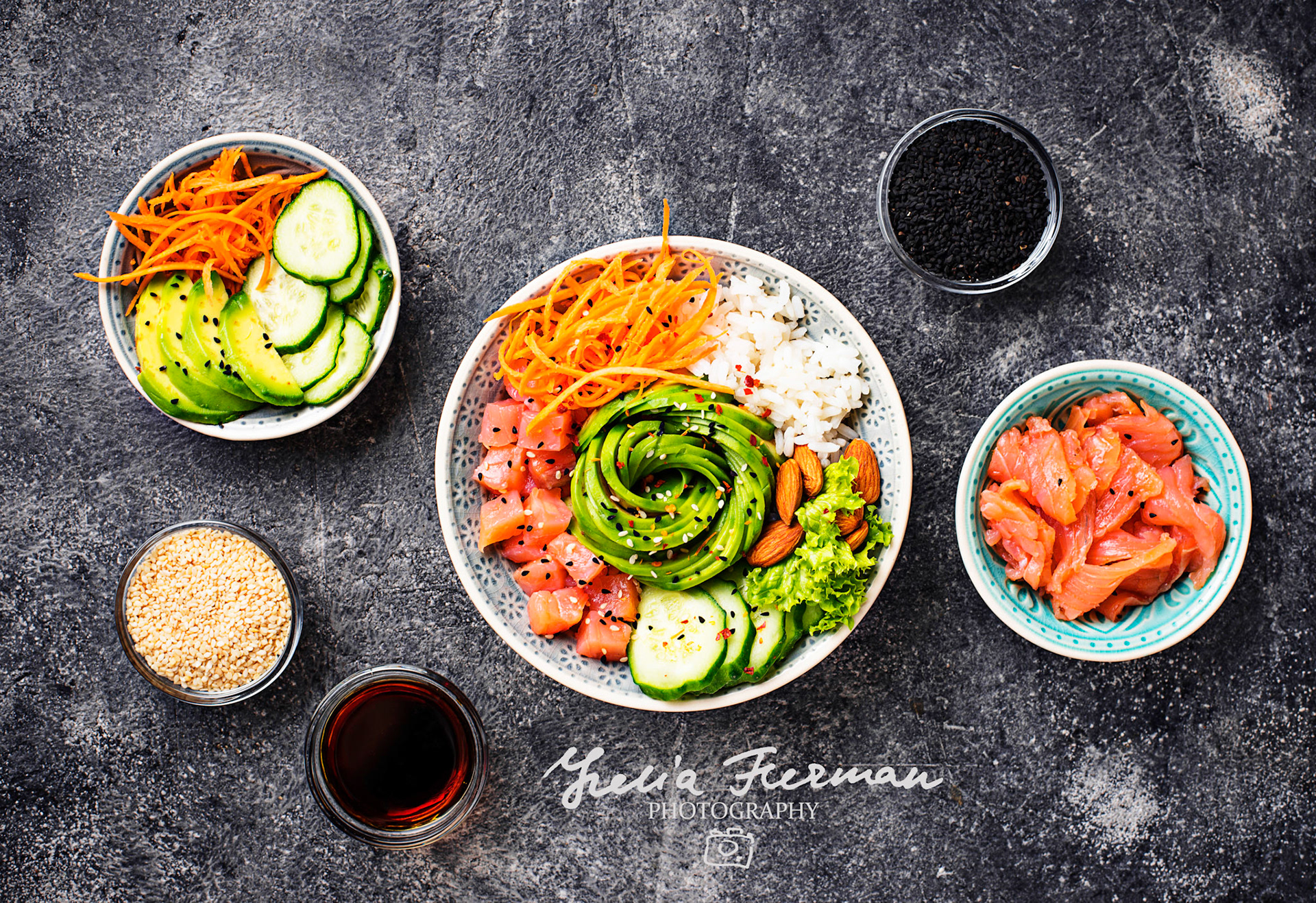 Hawaiian poke bowl with salmon, rice, avocado, carrot and cucumber