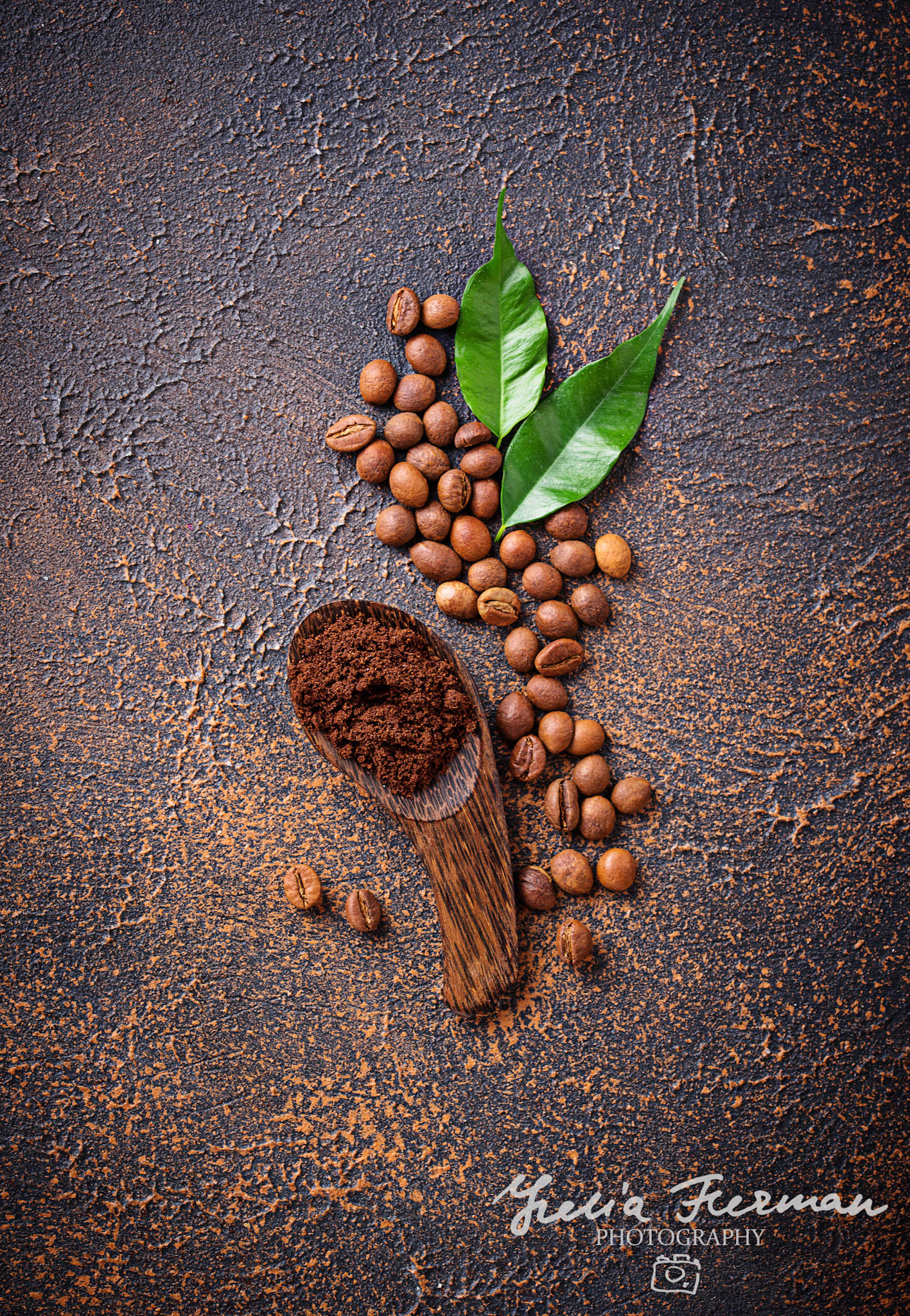 Roasted beans and ground coffee on rusty background. Top view