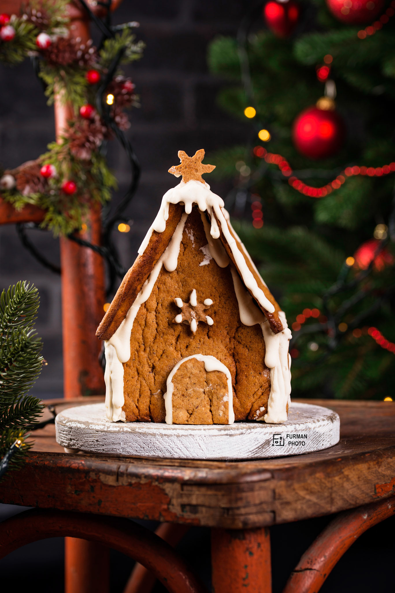 Christmas homemade gingerbread house on old rustic chair