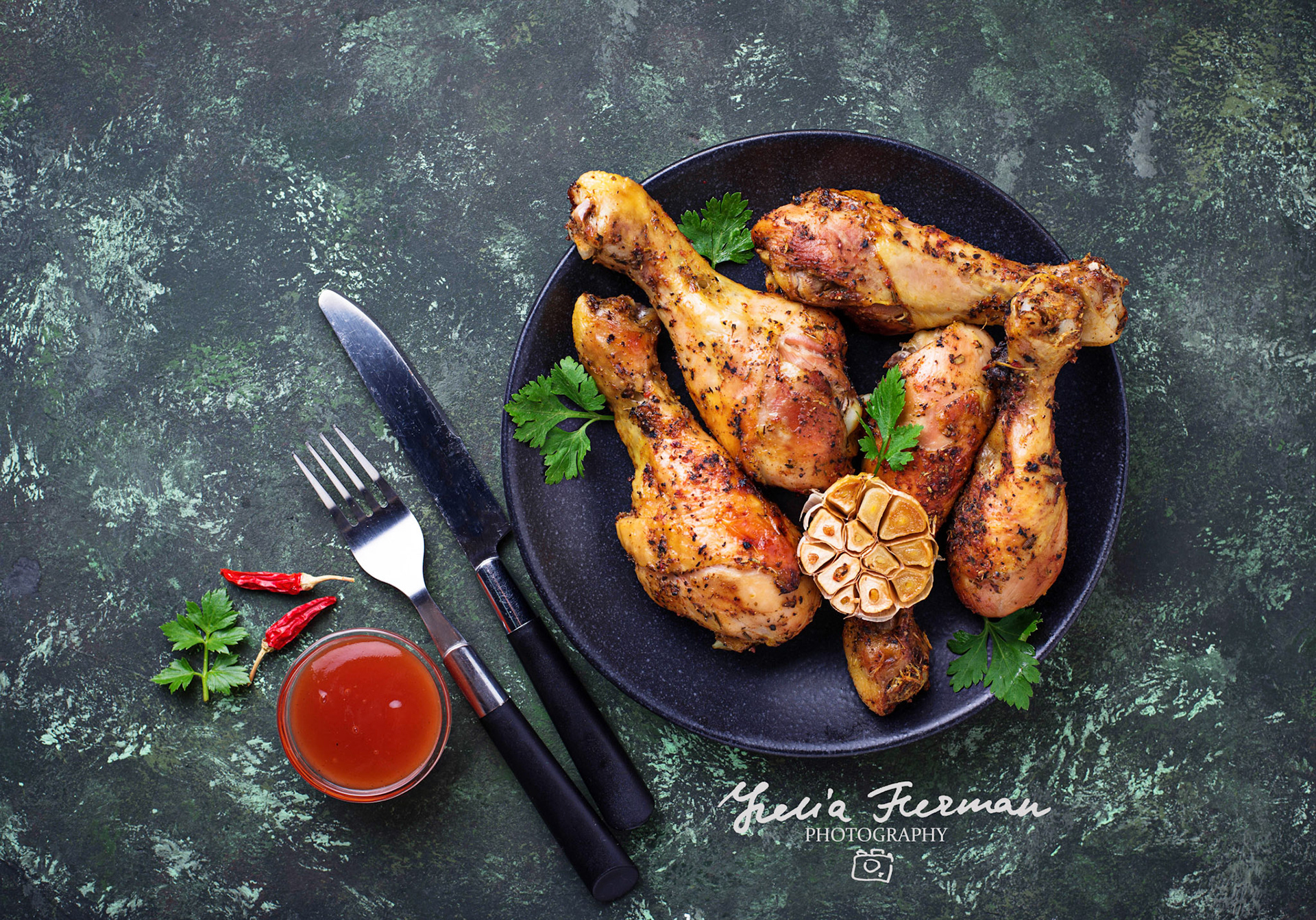 Grilled chicken legs with spices and garlic. Top view