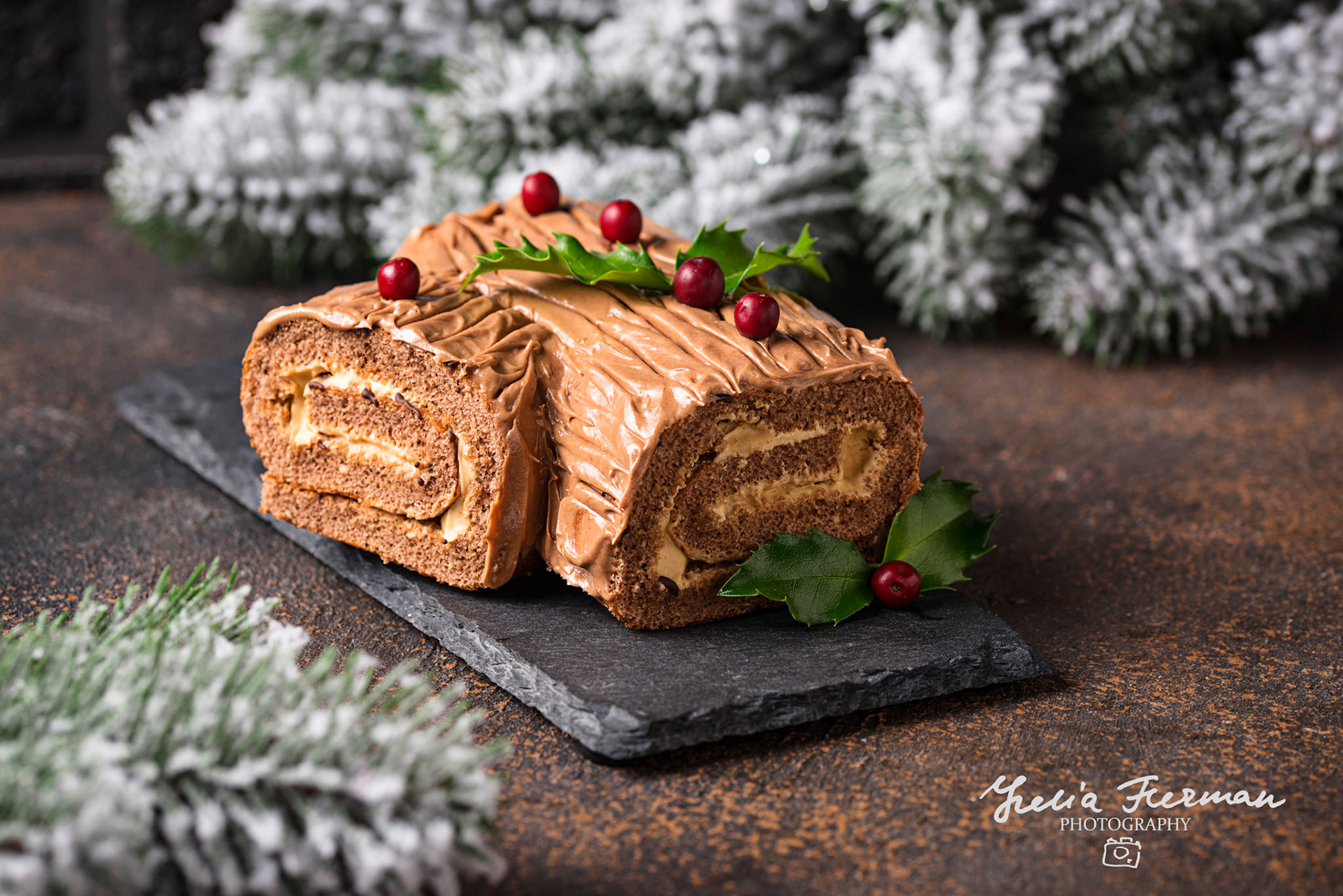 Christmas yule log cake. Traditional chocolate dessert on festive background