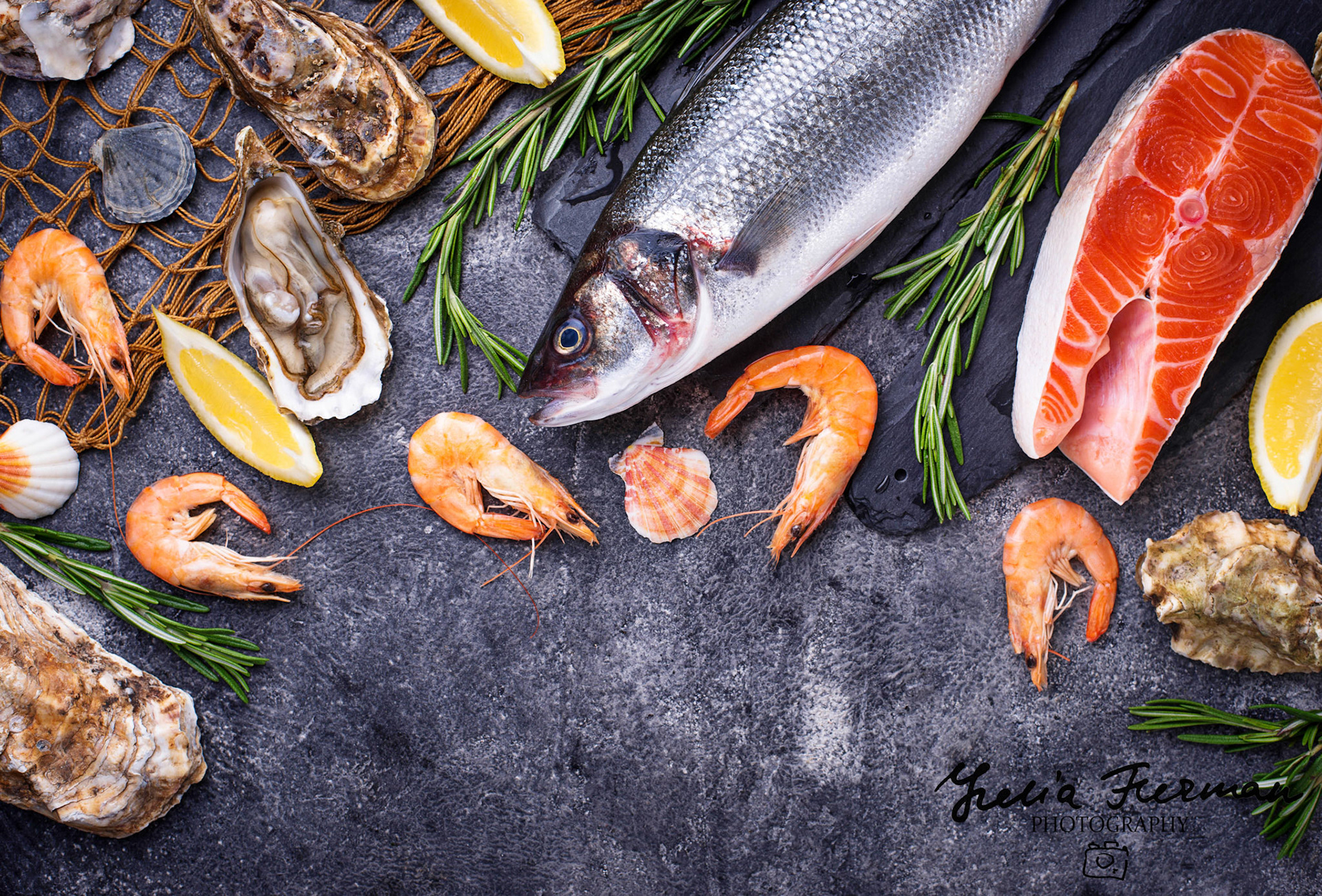 Salmon, seabass, shrimps and oysters. Seafood concept. Top view