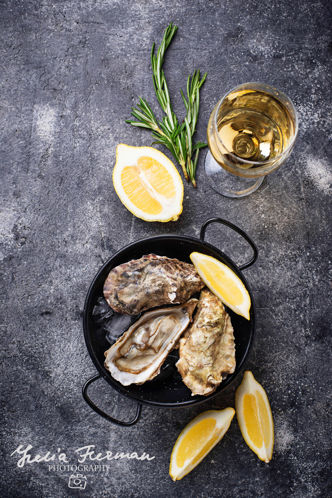 Fresh oysters with lemon and white wine. Top view