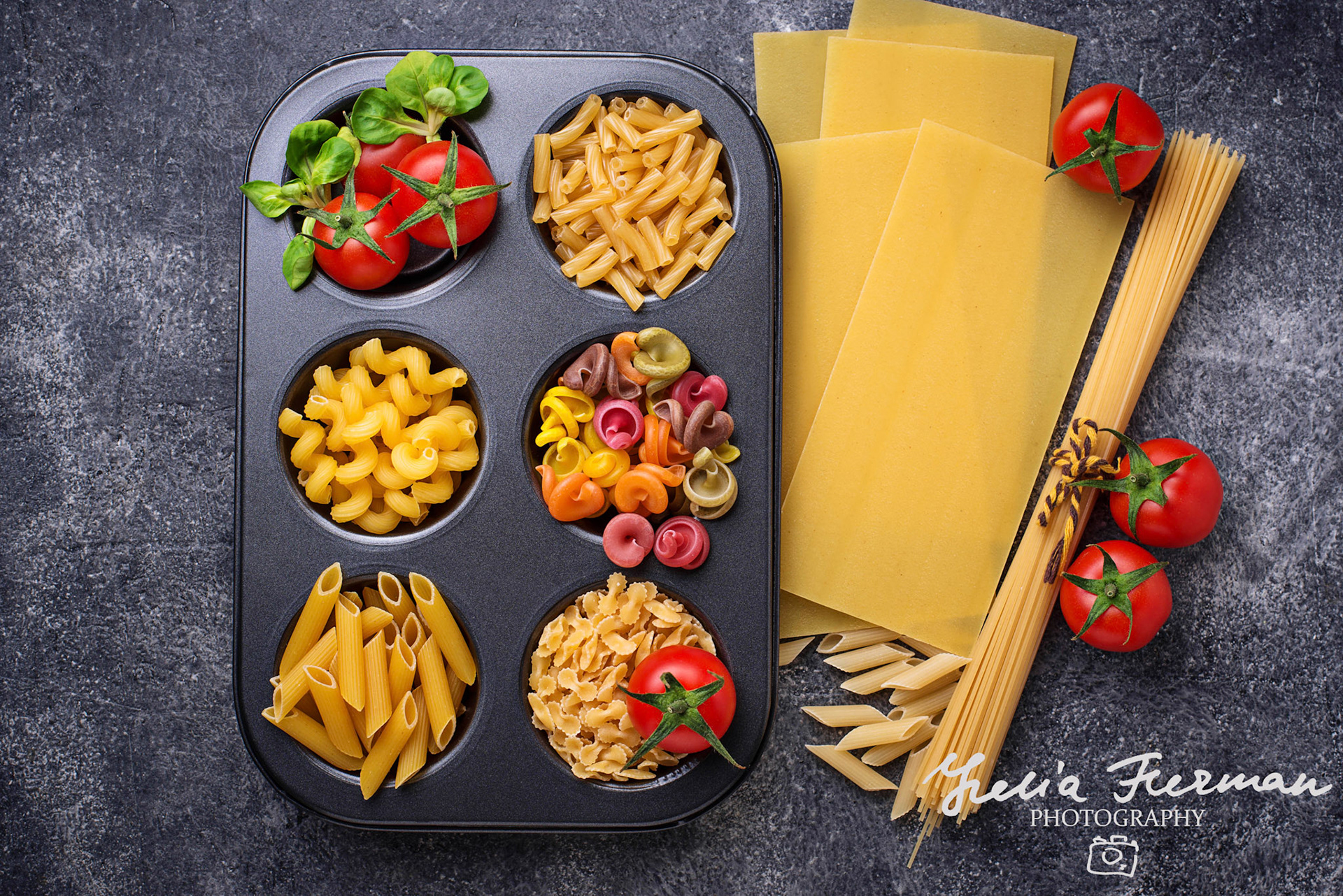 Various type of pasta and cherry tomato. Top view