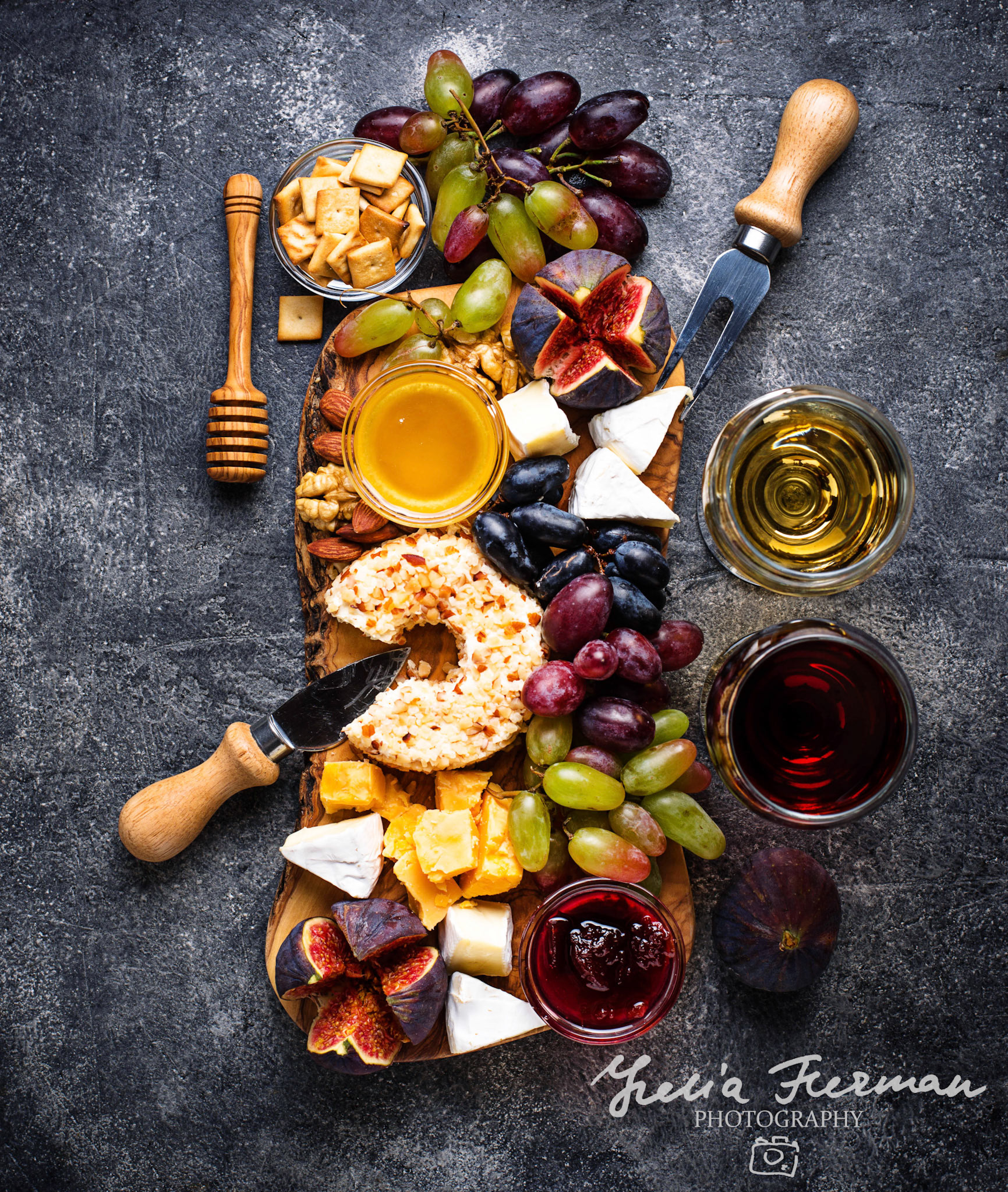Cheese plate with grapes, figs, dips and wine. Top view