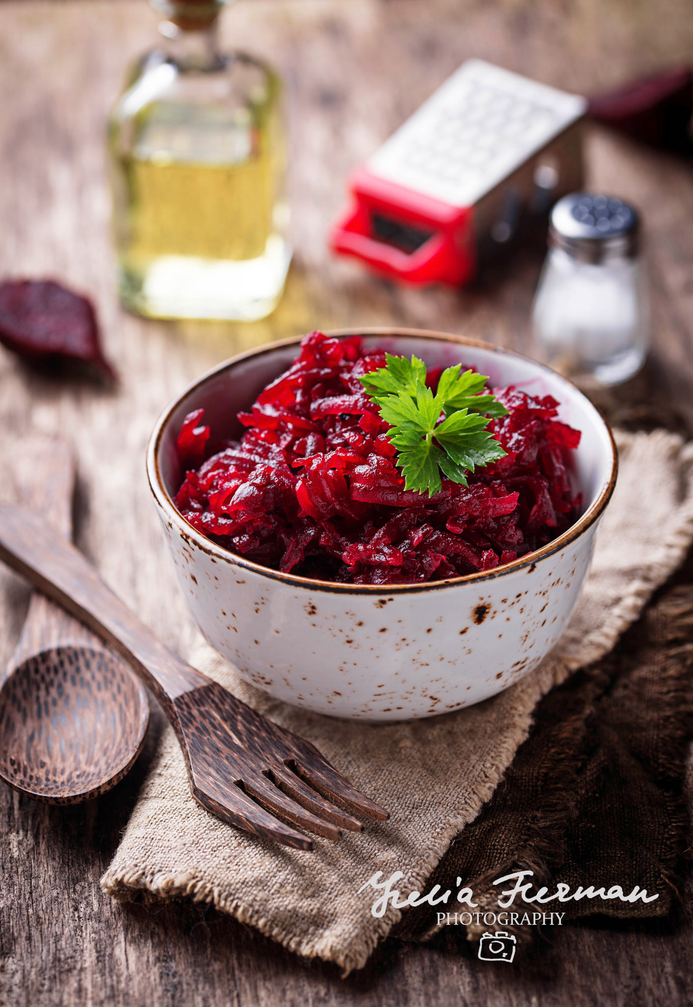 Bowl of beetroot salad on wooden background. Selective focus