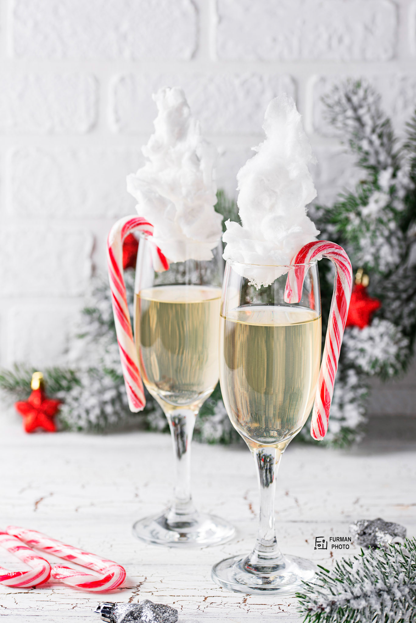 Glasses of champagne or prosecco with cotton candy.  Christmas or New year festive drink