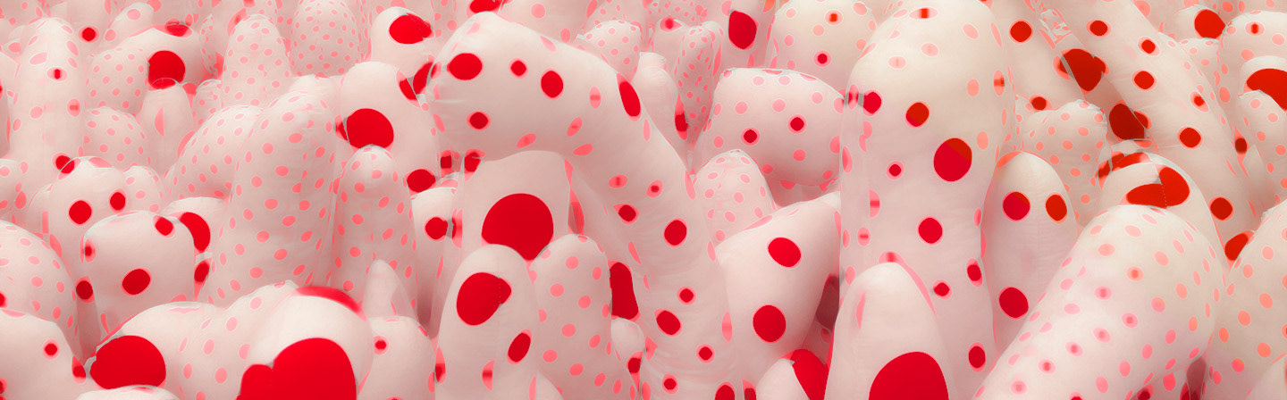 Red polka dots of various size scattered on white tubes, stuffed with cotton stuffing, and made to look like tentacles. It is part of an "Infinity Room" series by the artist Yayoi Kusama. This photo was edited in Photoshop and taken at the Hirschorn Museum in Washington D.C.